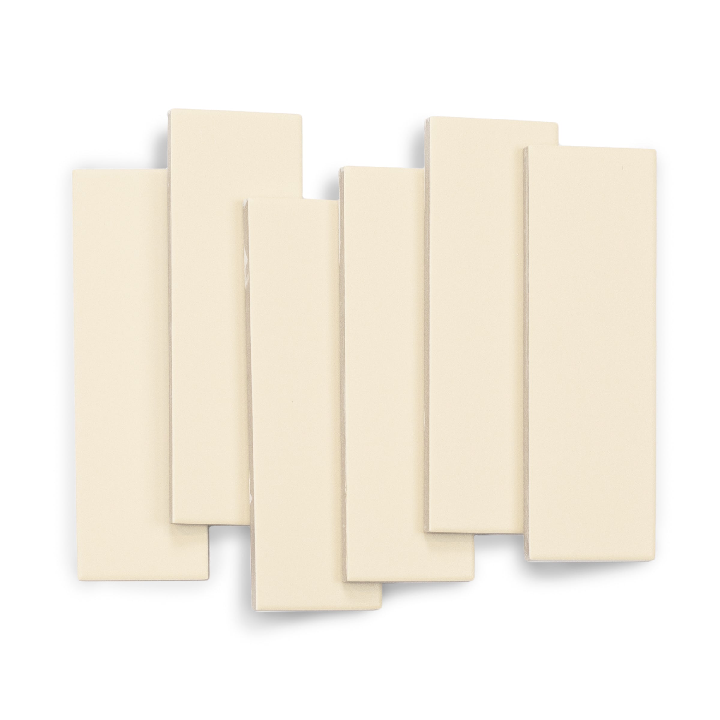 Matte porcelain tiles in soft creamy beige with smooth surface and clean straight edges arranged in overlapping pattern