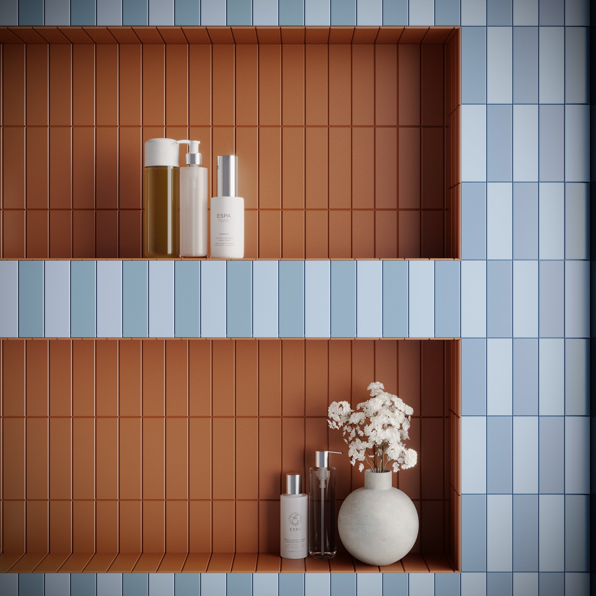Recessed shelves with vertical terracotta tiles holding toiletries and white flowers against light blue tiled wall