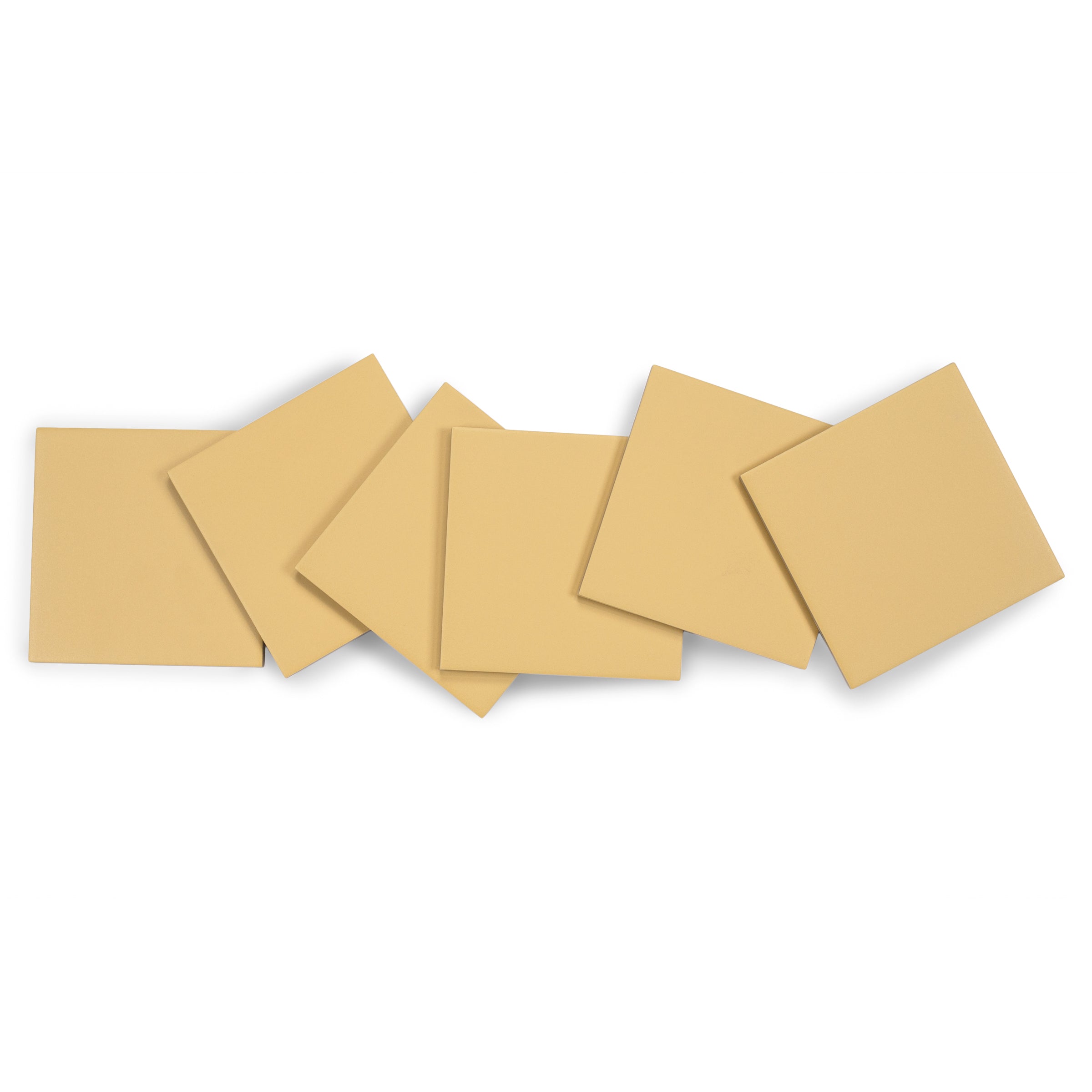 Matte porcelain tiles in warm beige tone with smooth surfaces and sharp edges arranged in a casual overlapping layout