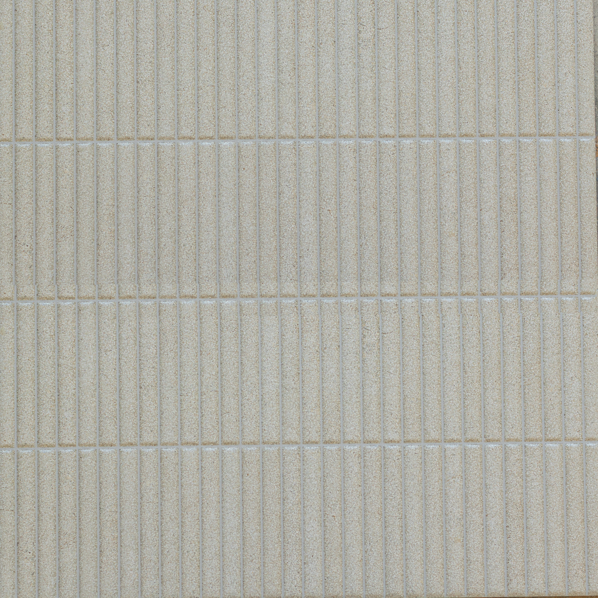 Close-up of matte porcelain tile with linear texture in soft almond beige, showcasing subtle grooves and minimal pattern.