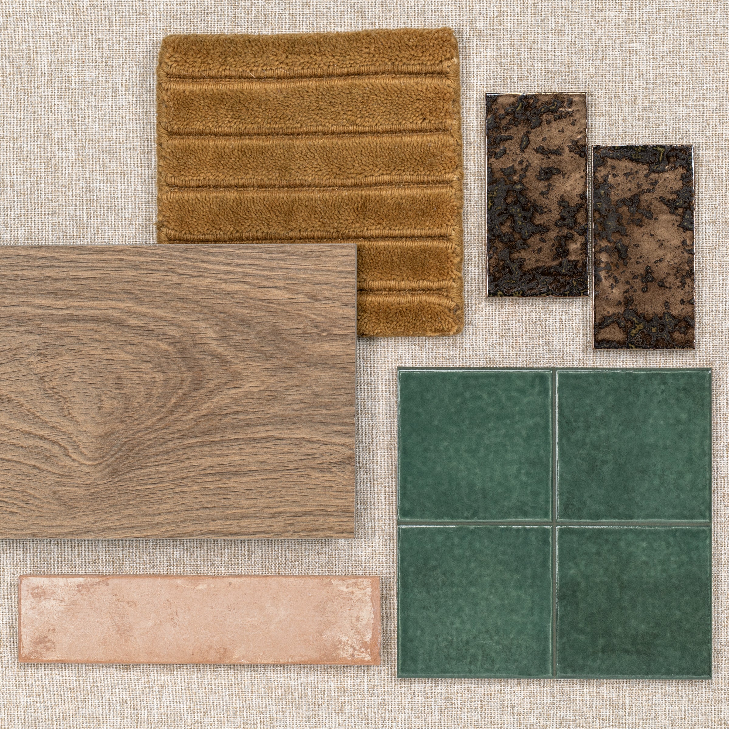 Assorted tile and flooring samples including wood, green ceramic, terracotta, brown textured, and plush fabric pieces.