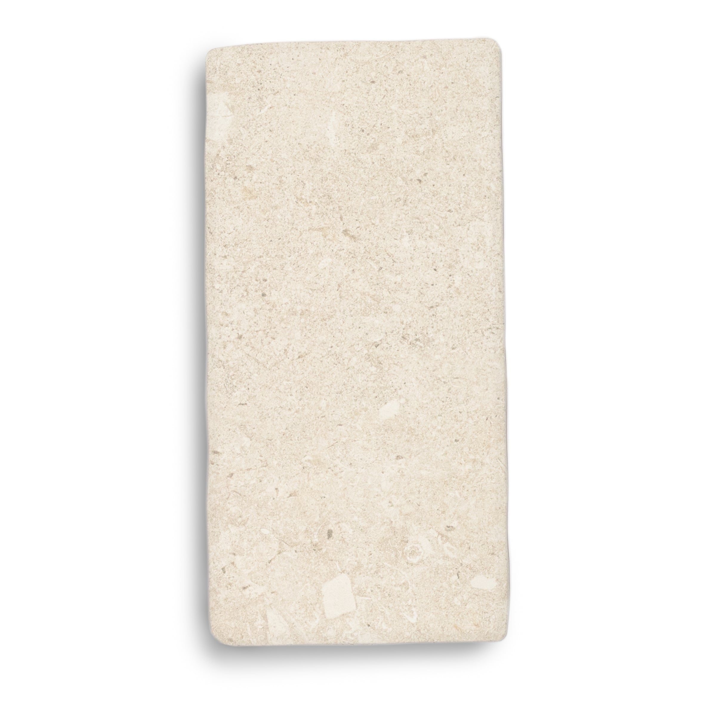 Rectangular cream porcelain tile with a subtle natural stone texture and soft off-white tones on a plain background