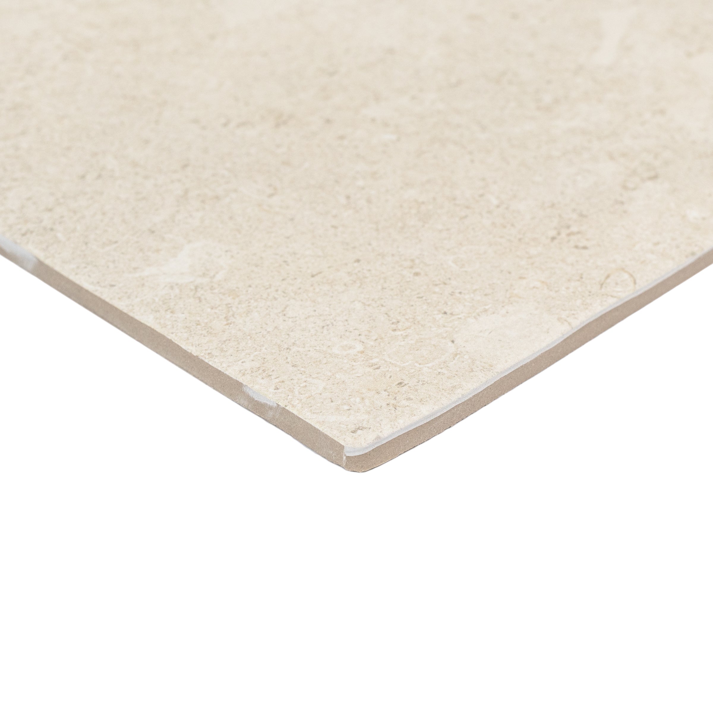Close-up of a single cream-toned porcelain tile with a smooth stone-inspired surface and matte finish on a white background