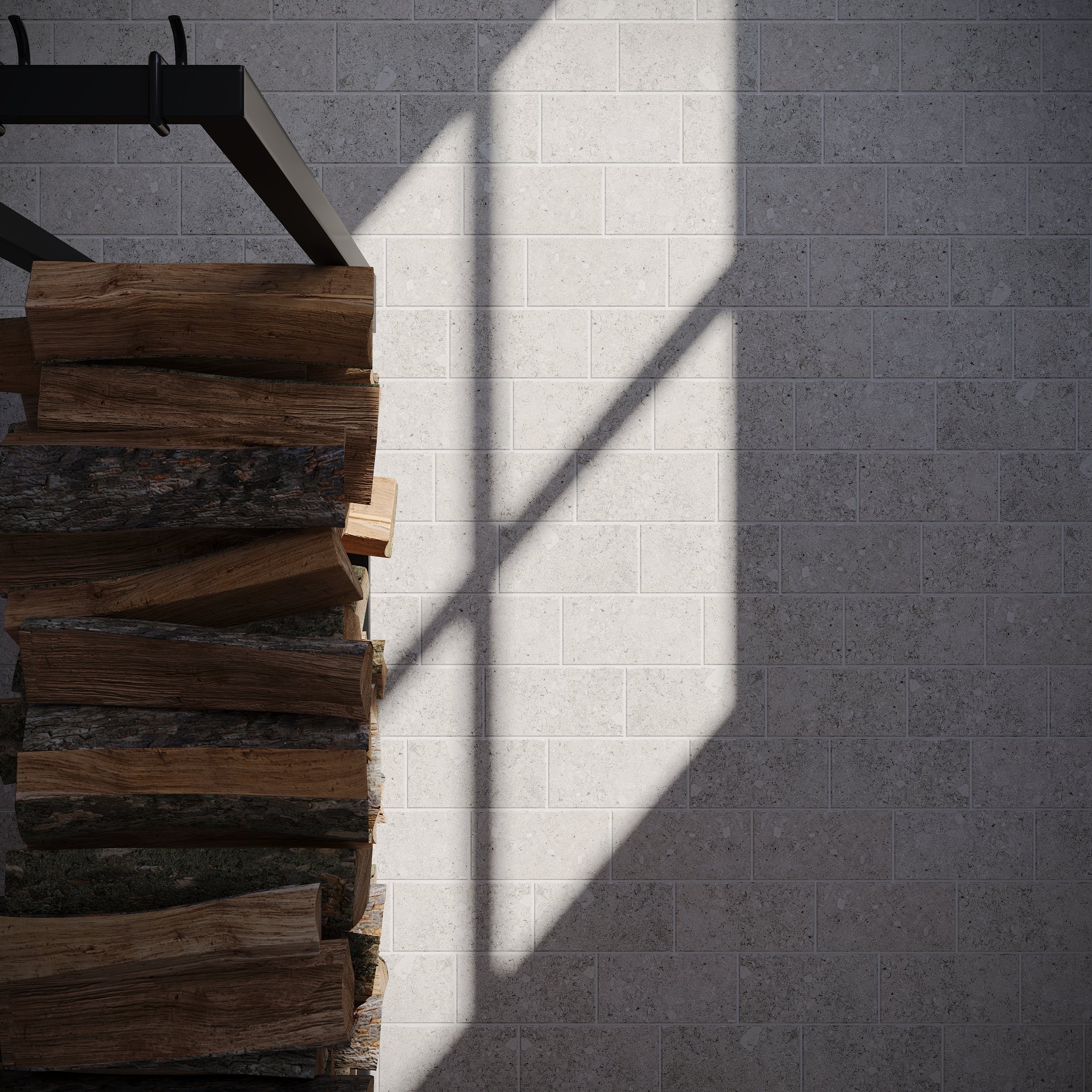 Natural light casting window shadows on textured gray ceramic tiles beside stacked firewood logs on a metal rack