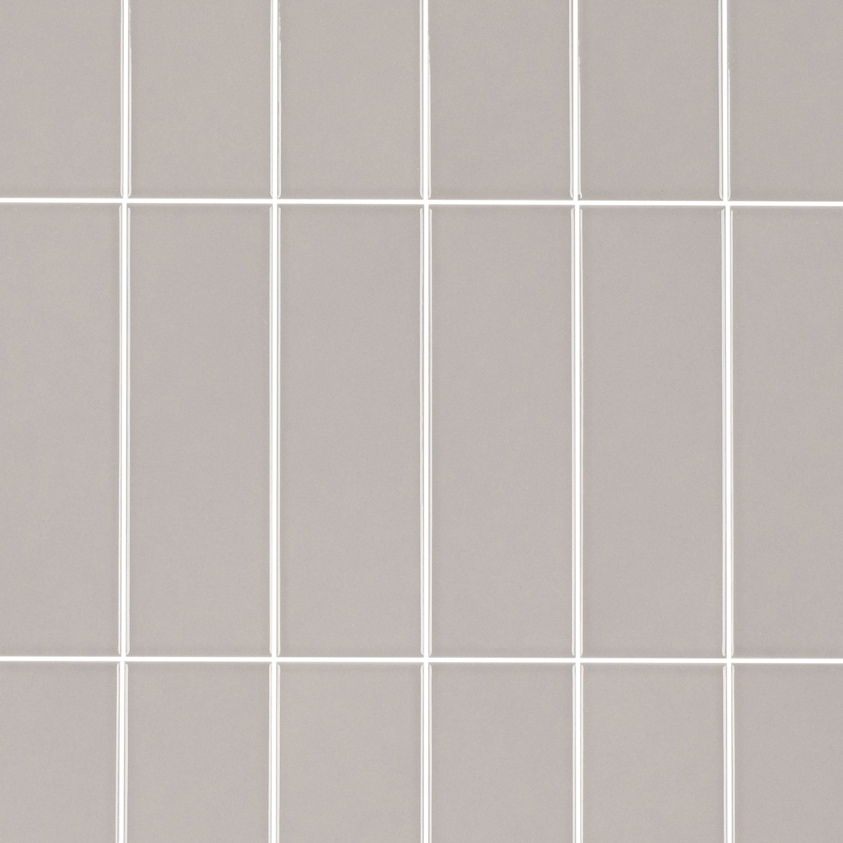 Colorblock Porcelain Tile in soft grey with glossy finish featuring small format tiles from New Arrivals Porcelain collection