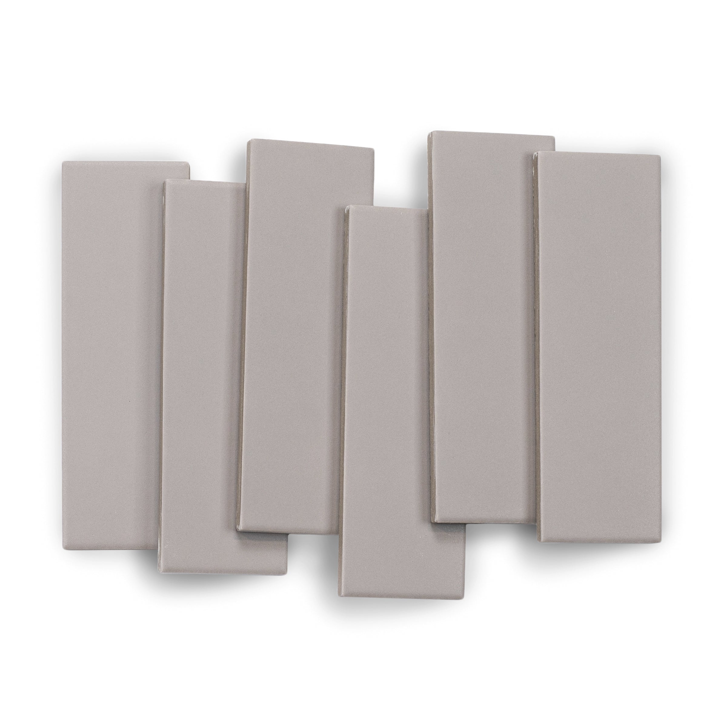 Matte porcelain tile in muted ash gray with smooth texture and clean edges arranged in a staggered layout