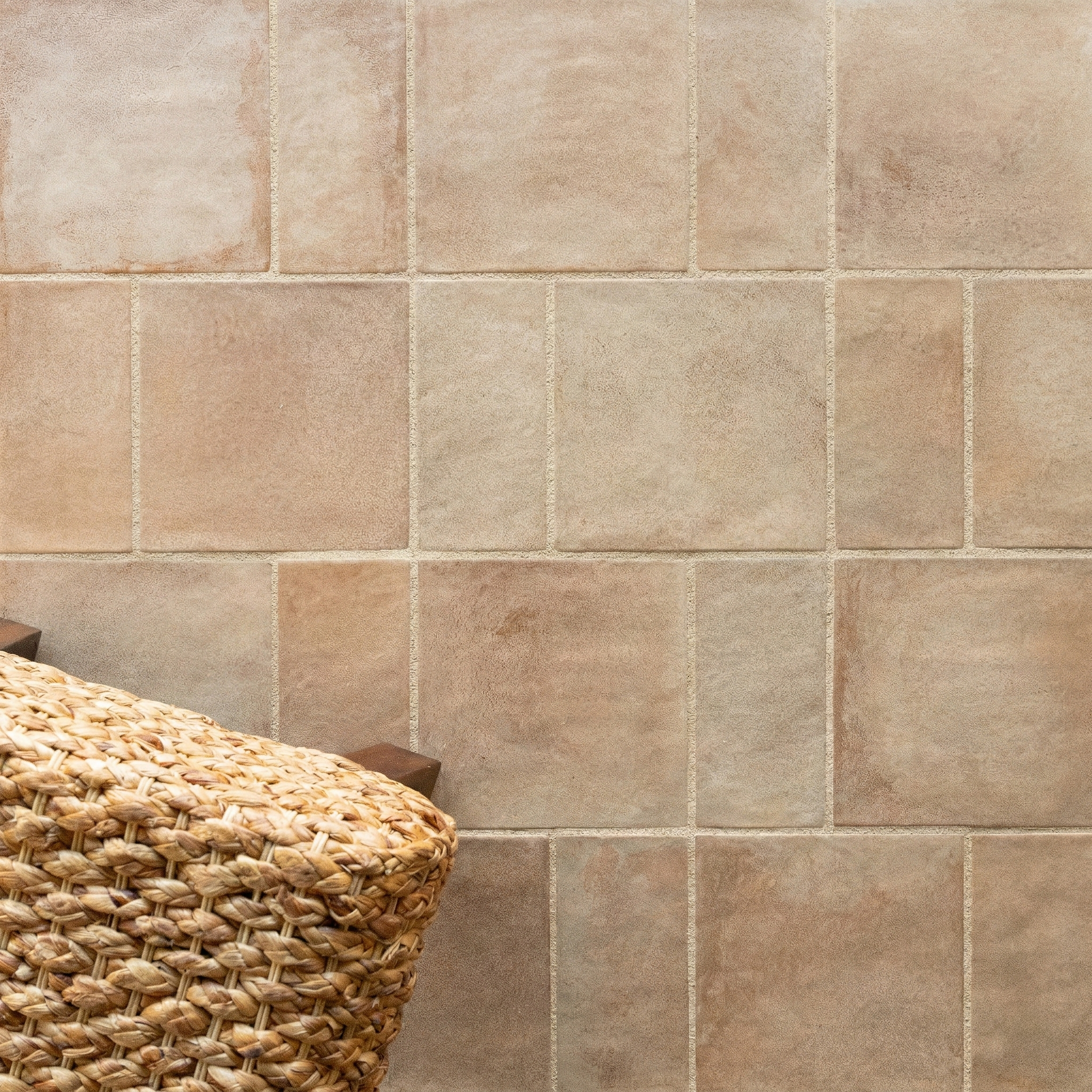 Matte terracotta ceramic tiles in varied square and rectangular shapes with a warm, earthy tone and subtle texture