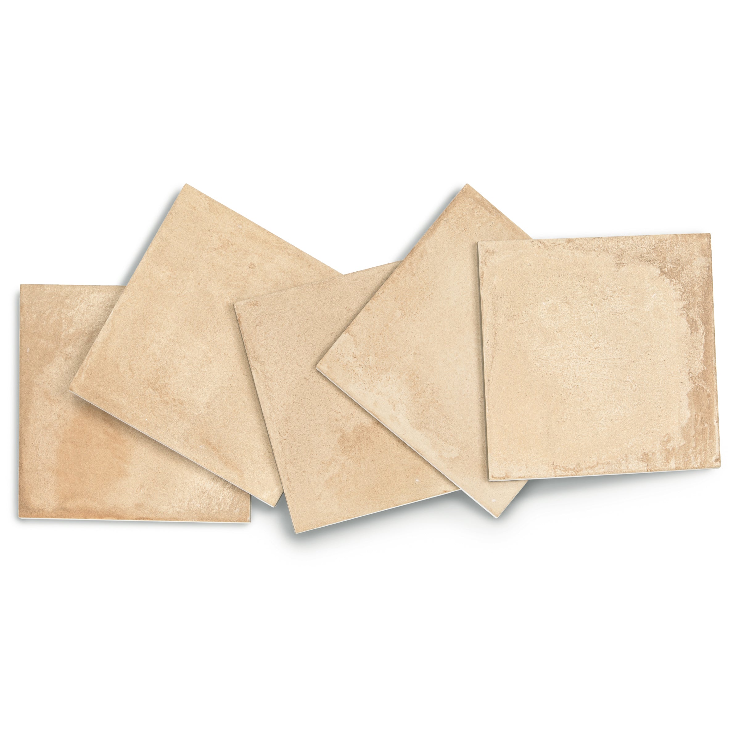 Beige ceramic tiles arranged in an overlapping pattern on a white background