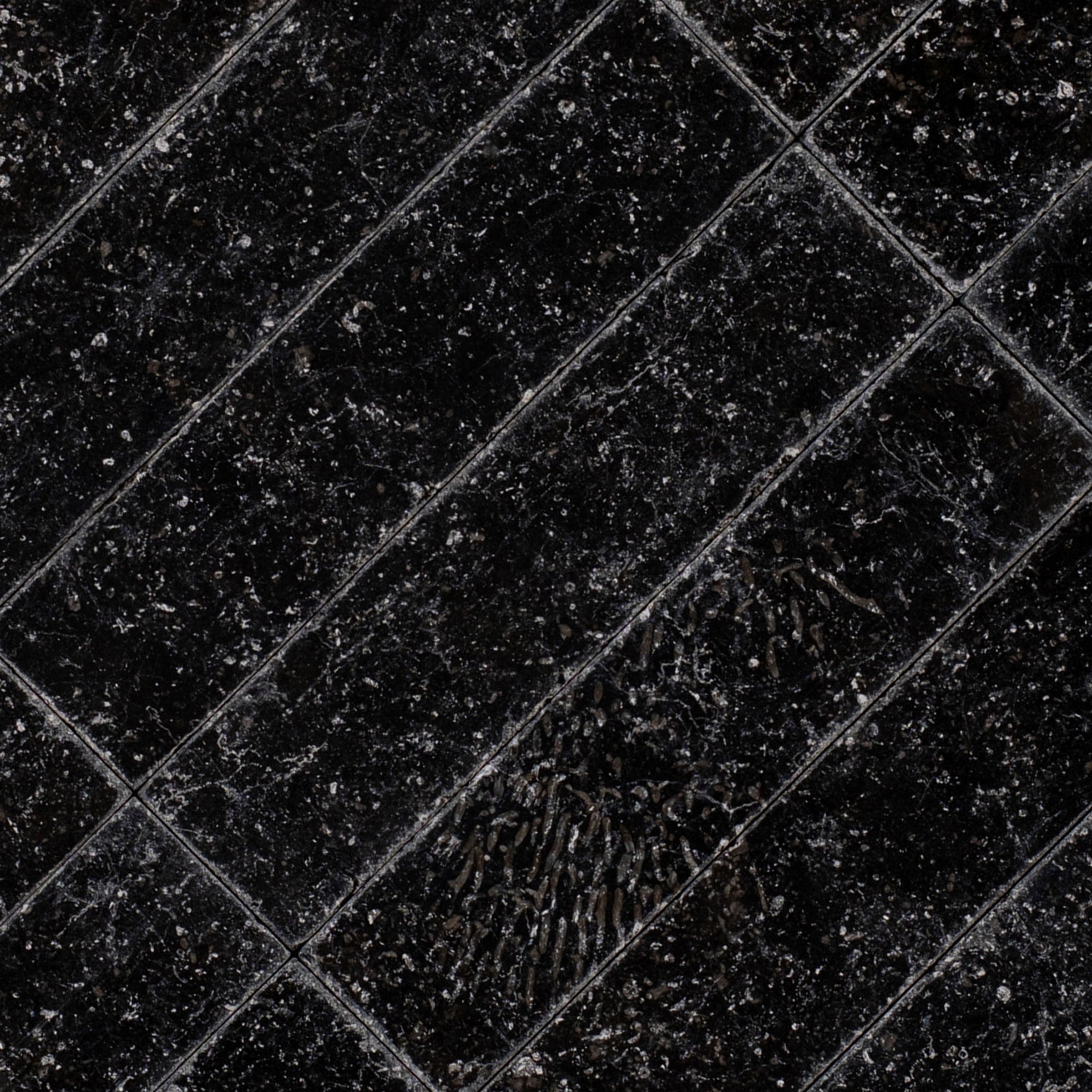 Belgian Blue 2x8 Tumbled Marble Tile in black with subtle blue undertones from Tumbled Natural Stone Tiles Stone New Arrivals