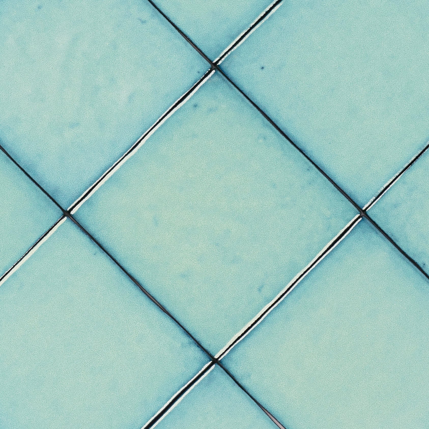 Turquoise Glossy Ceramic Tile in small format with subtle handcrafted texture from Small Format Tiles and Zel Glazed Ceramic Tiles collections