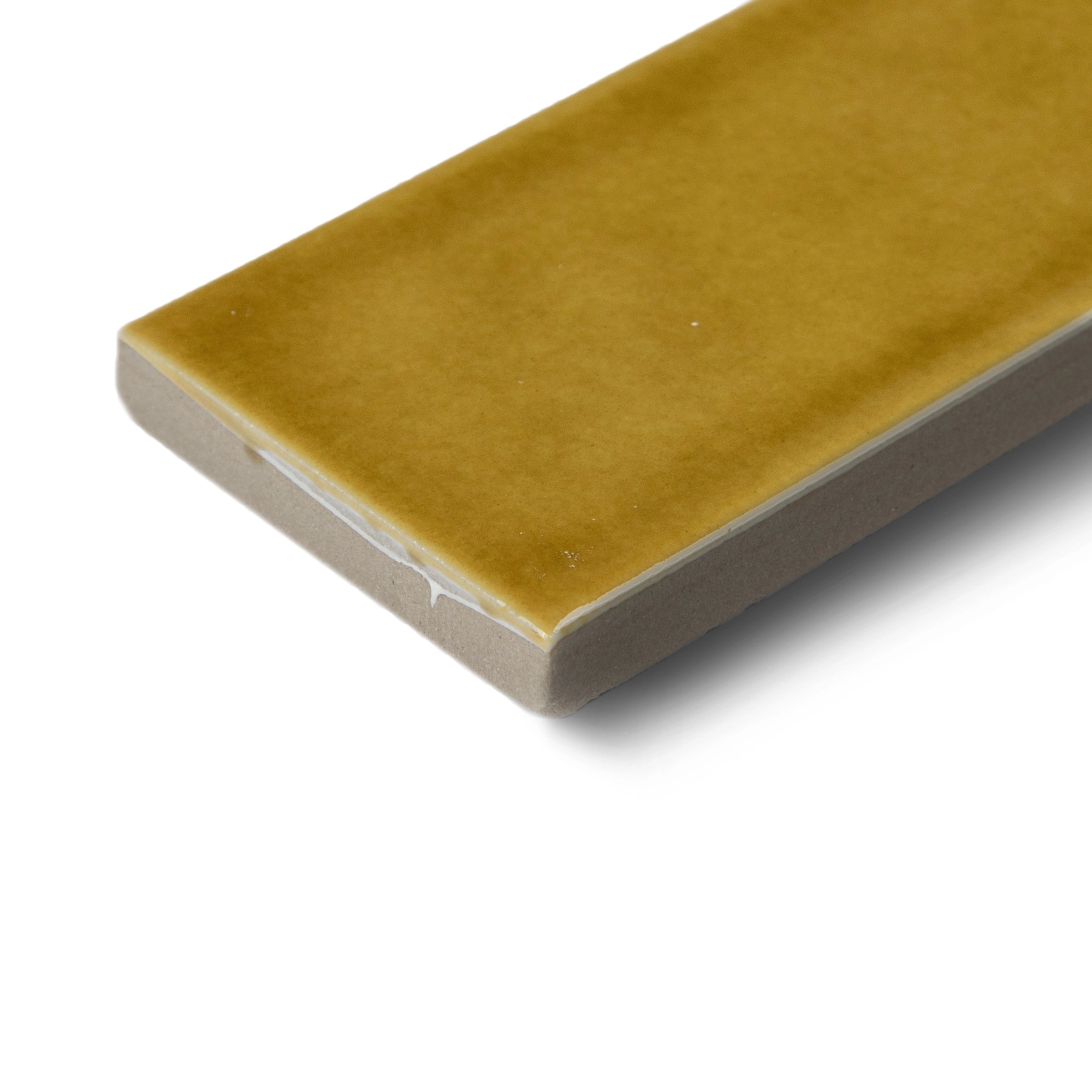 Glossy rectangular tile with smooth honey mustard surface and beveled edges on white background