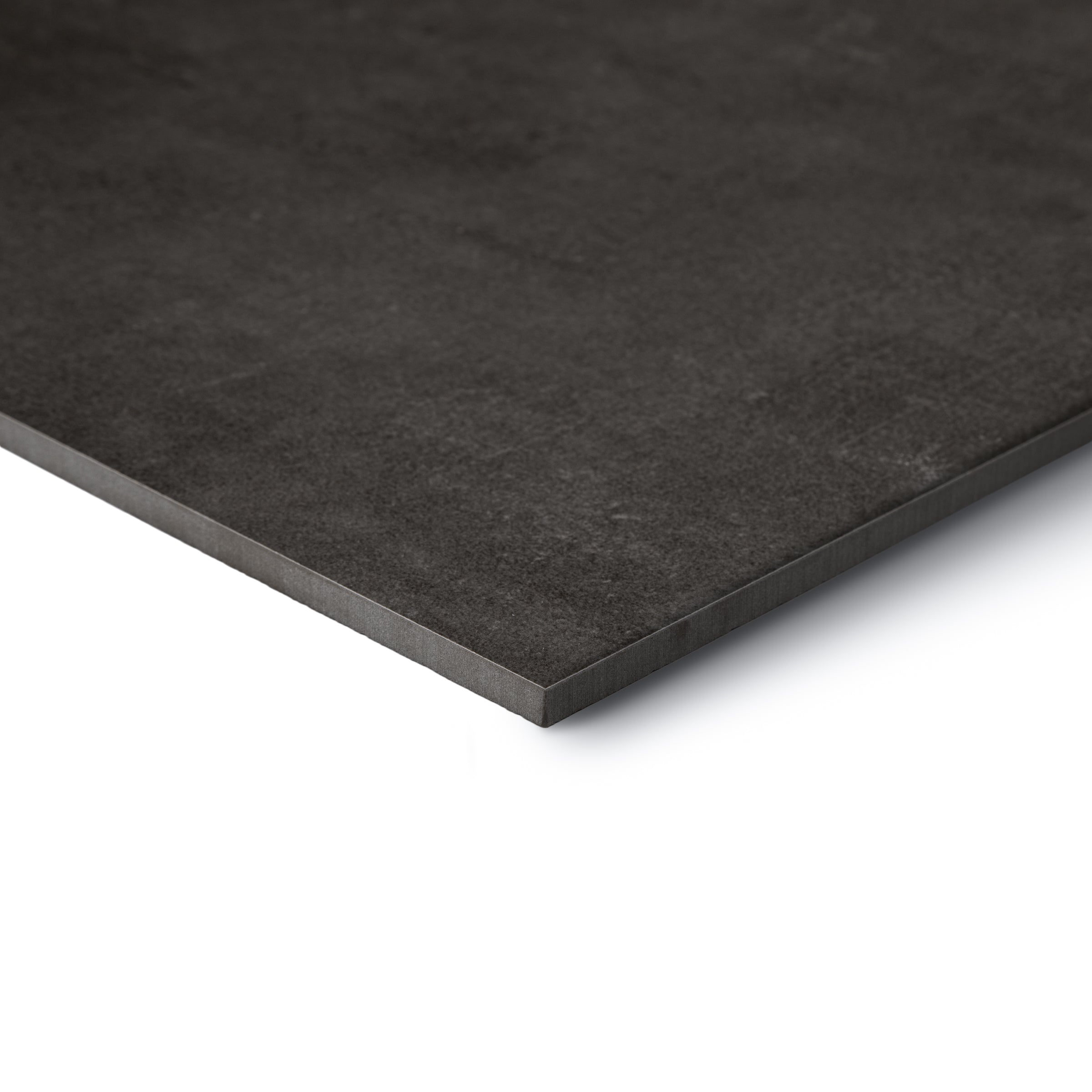 Dark charcoal textured square slab with a straight edge on a white background