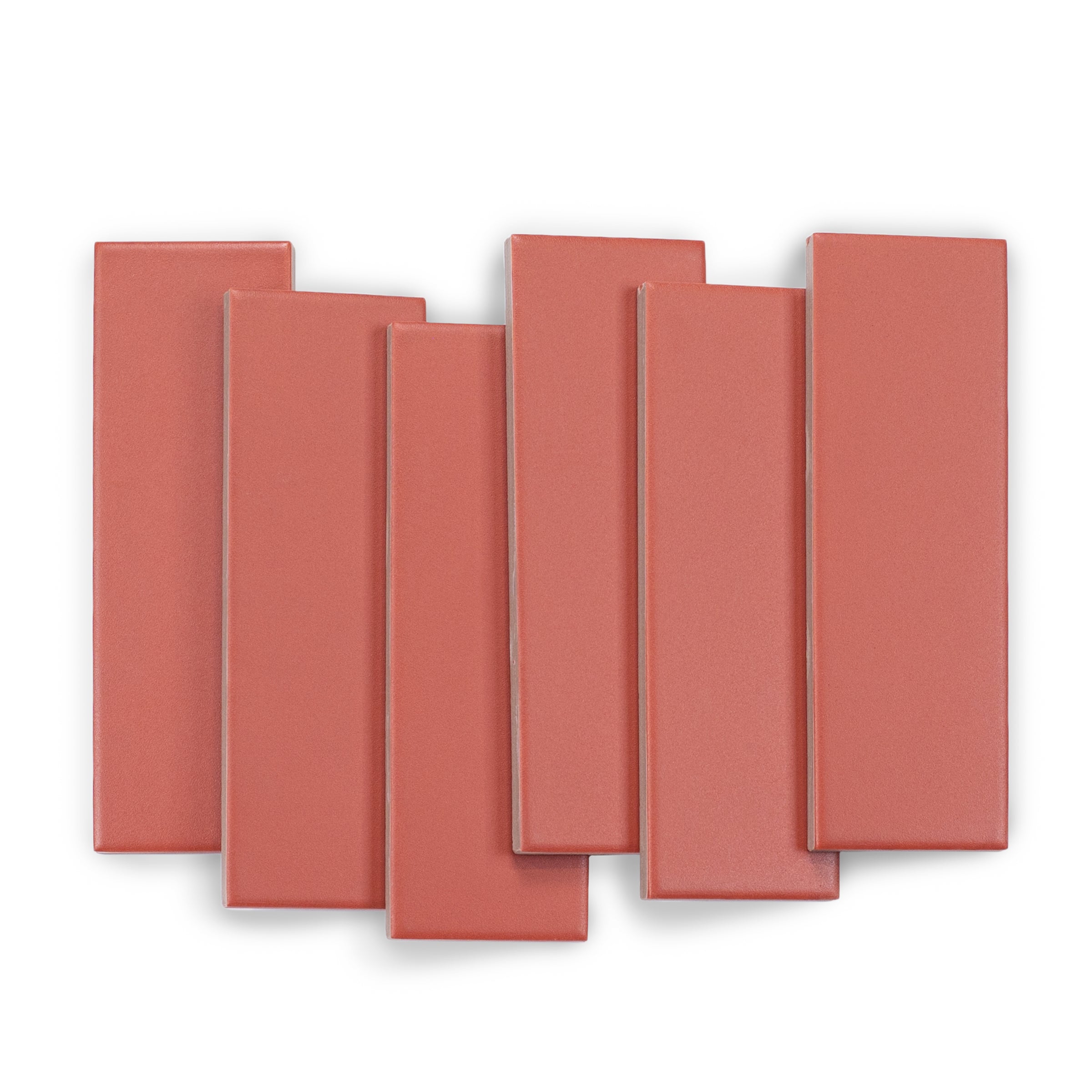 Six smooth porcelain tiles in a warm cinnamon shade with a matte finish arranged on a white surface