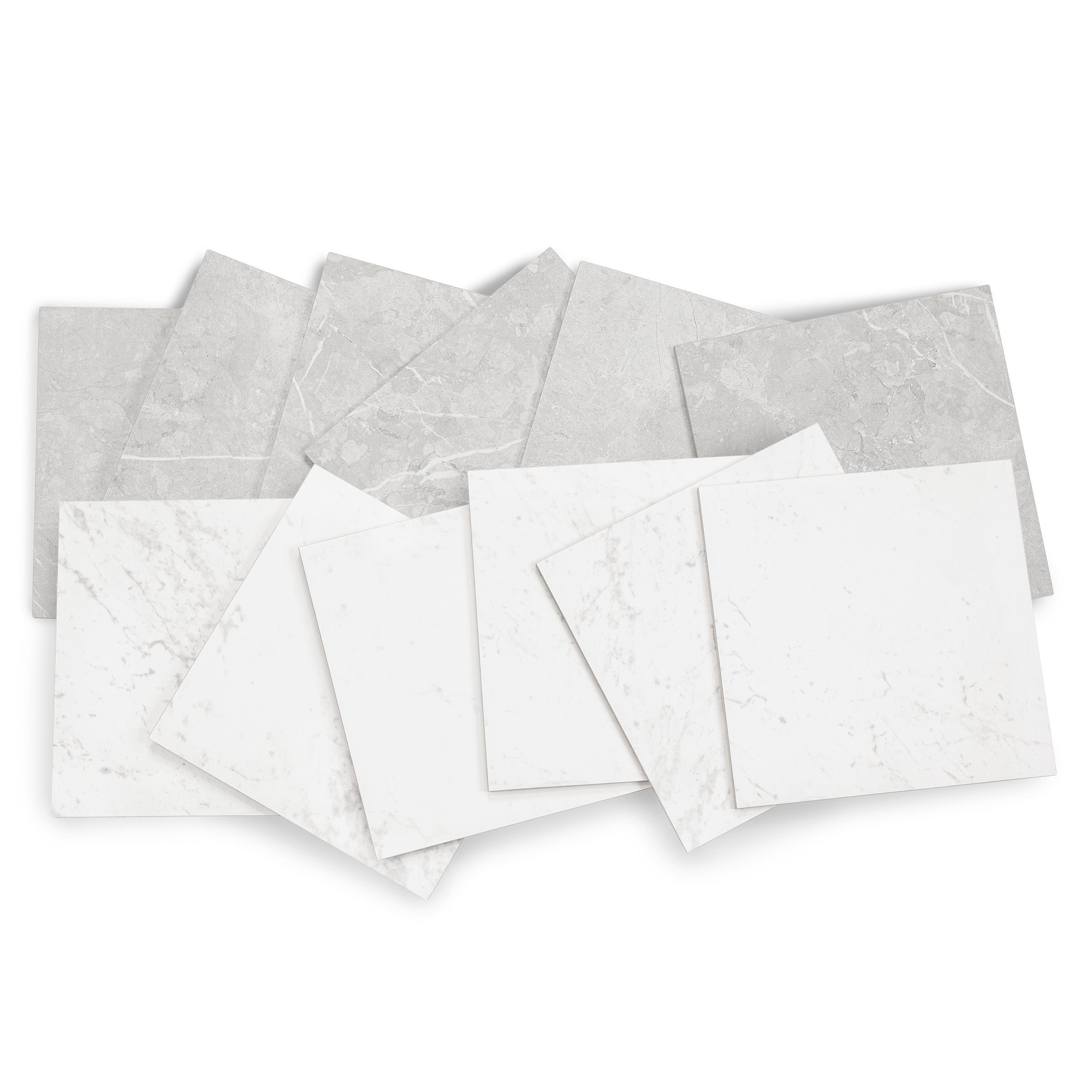 Collection of white and light gray ceramic tiles with subtle marble-inspired veining arranged in overlapping layers