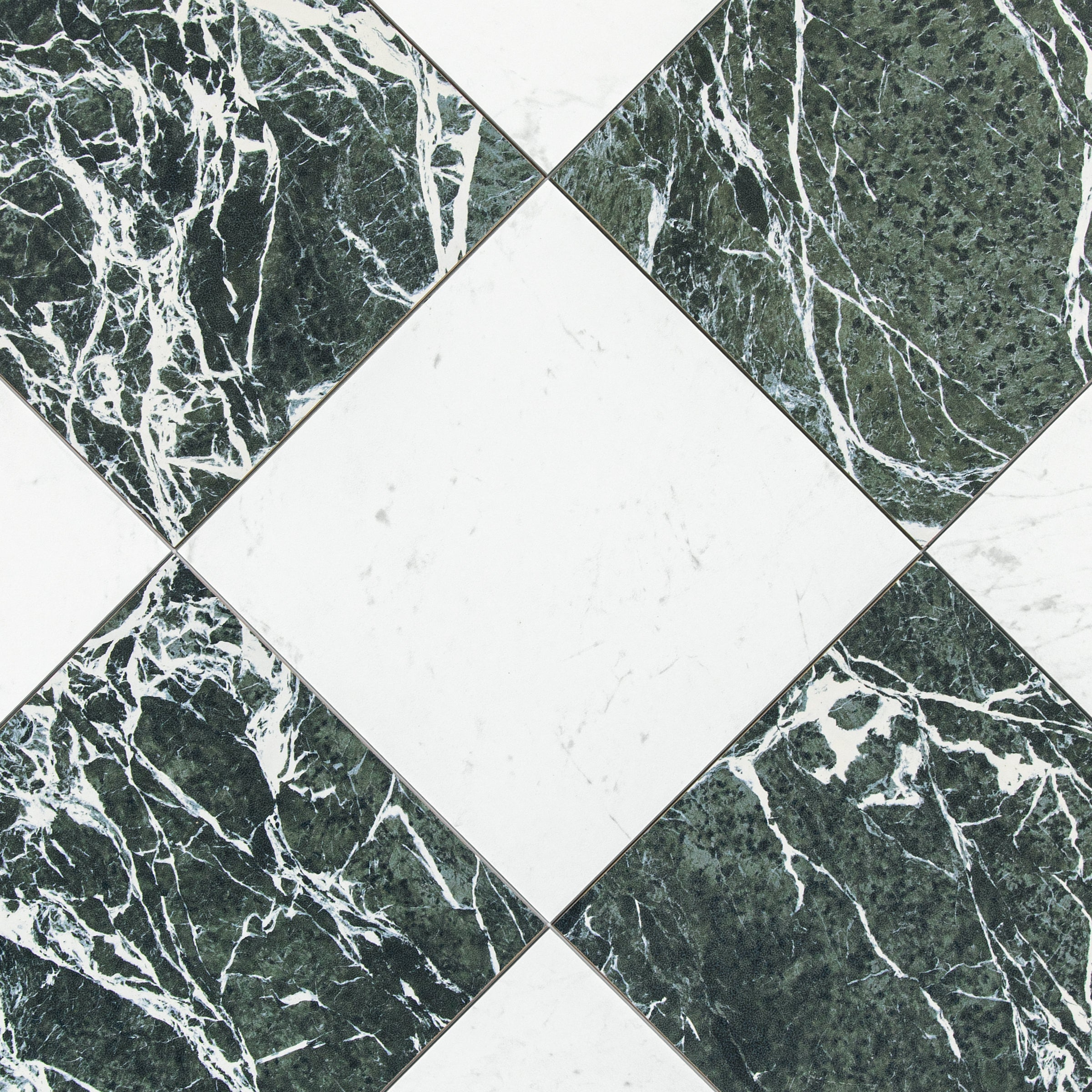 Close-up of a geometric pattern featuring alternating dark green and white marble-effect porcelain tiles arranged in a diamond layout