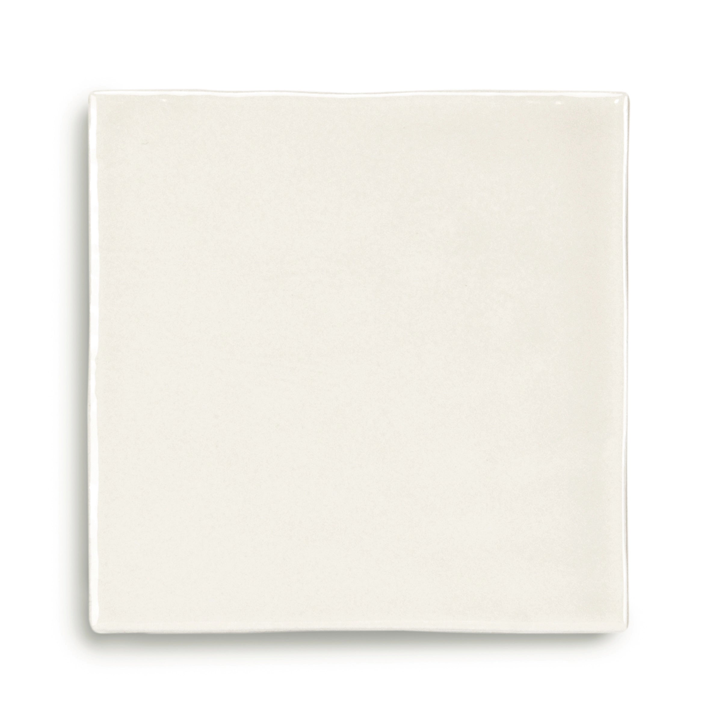 Square ceramic tile in soft natural shade with a smooth matte surface and subtle earthy undertones