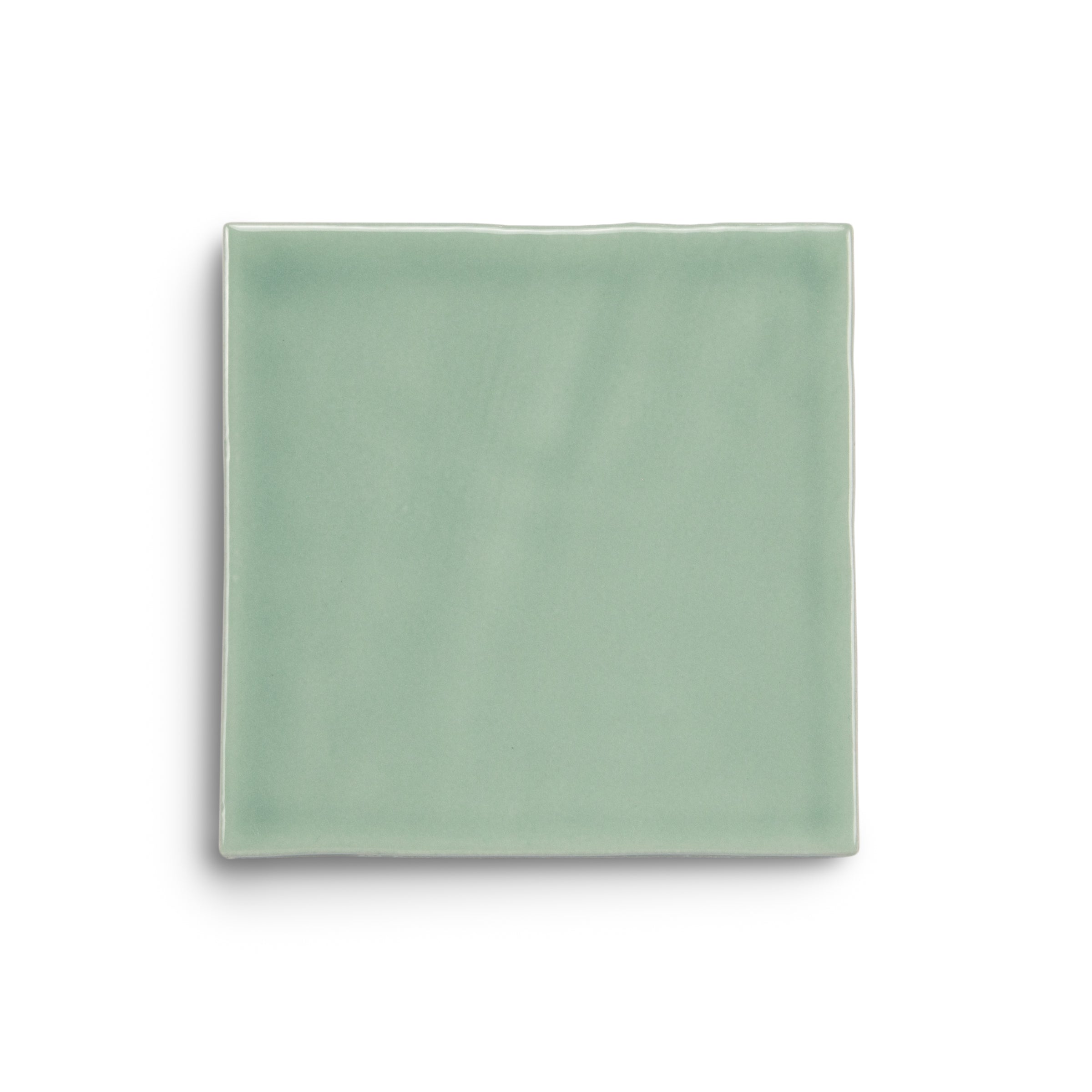 Pale green glazed ceramic tile with softly irregular edges