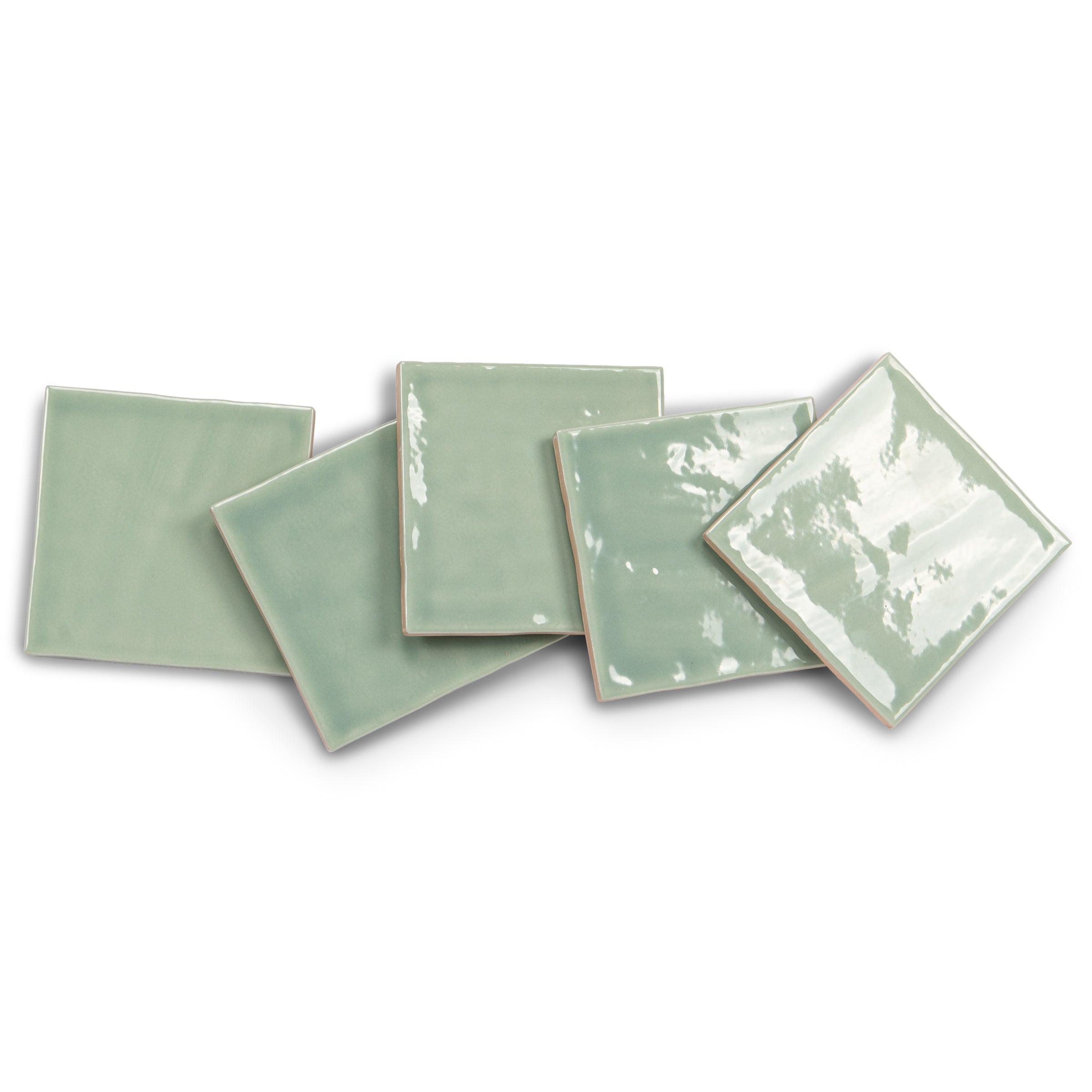 Glazed green ceramic tiles in assorted square and rectangular shapes