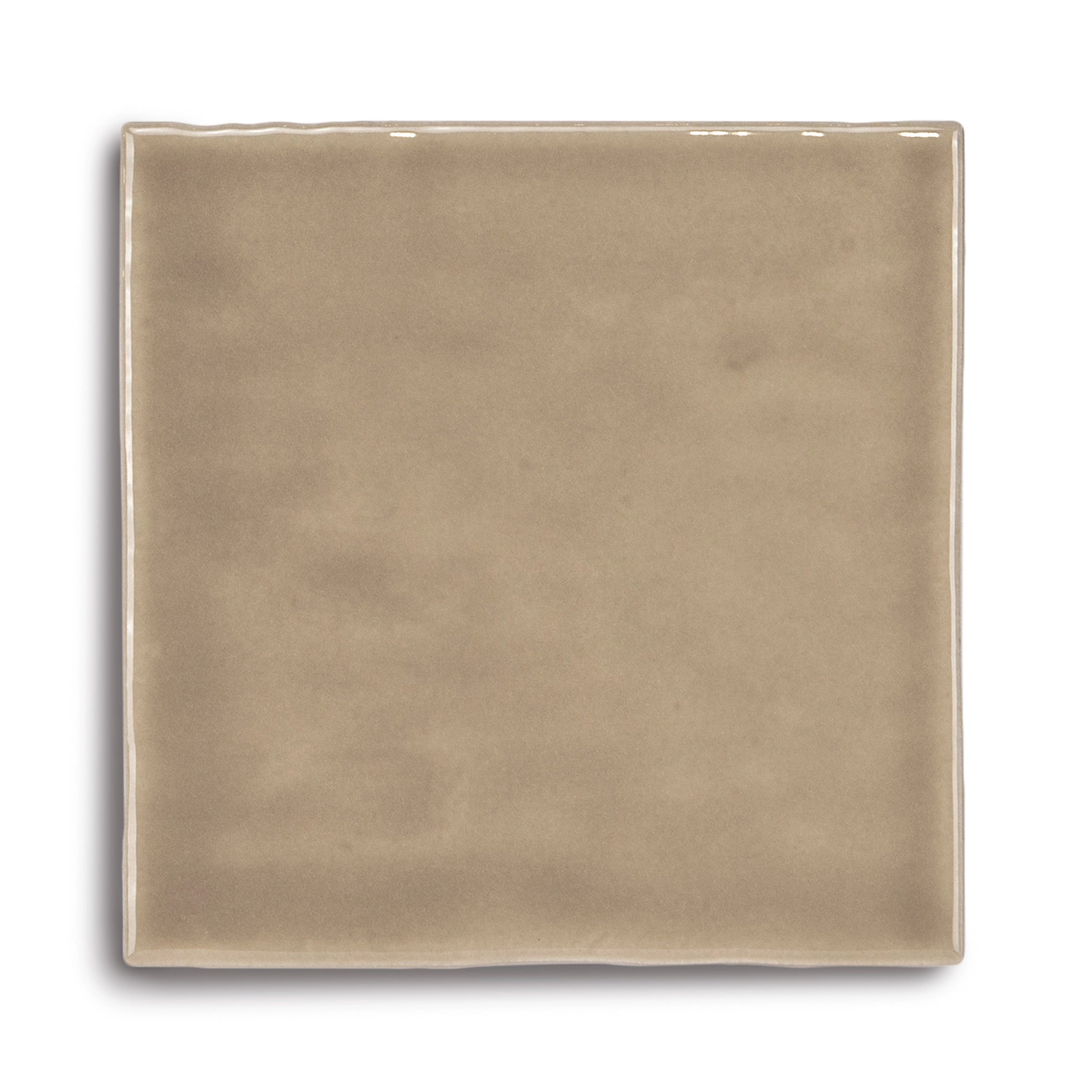 Square ceramic tile in warm sandy beige with a smooth glossy surface and subtle tonal variation on white background