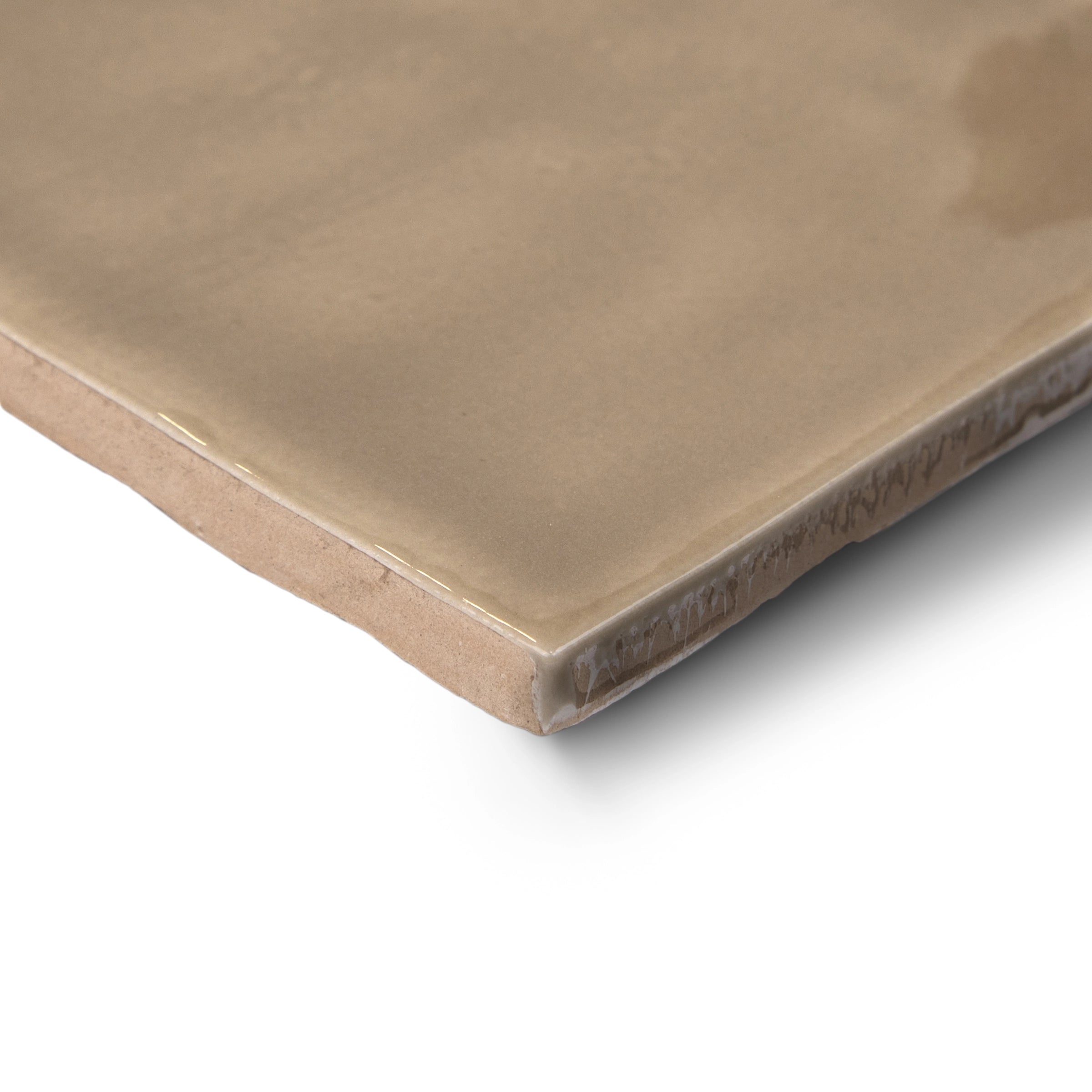 Glossy ceramic tile in warm sand tone with slightly rounded edges and a smooth, reflective surface on a white background