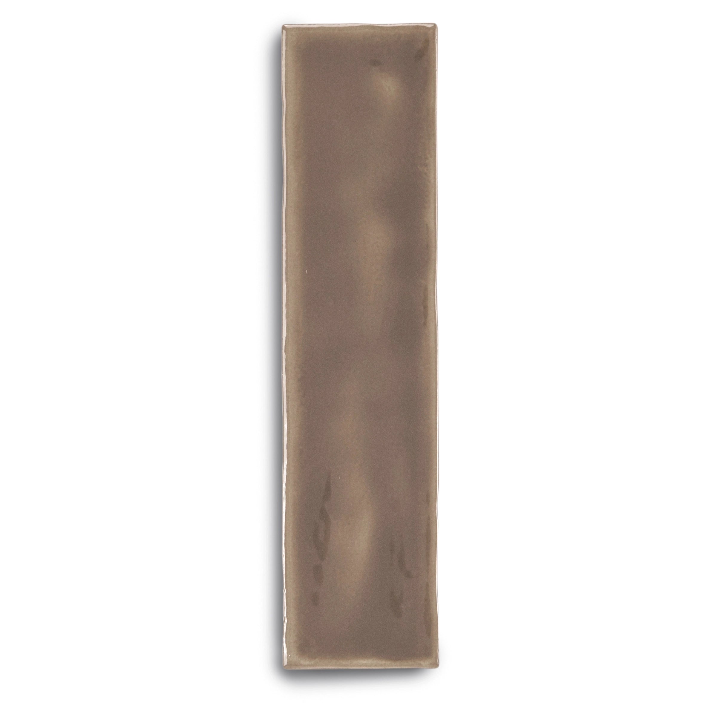 Long, narrow ceramic tile with a muted umber finish and subtle irregularities on a white background