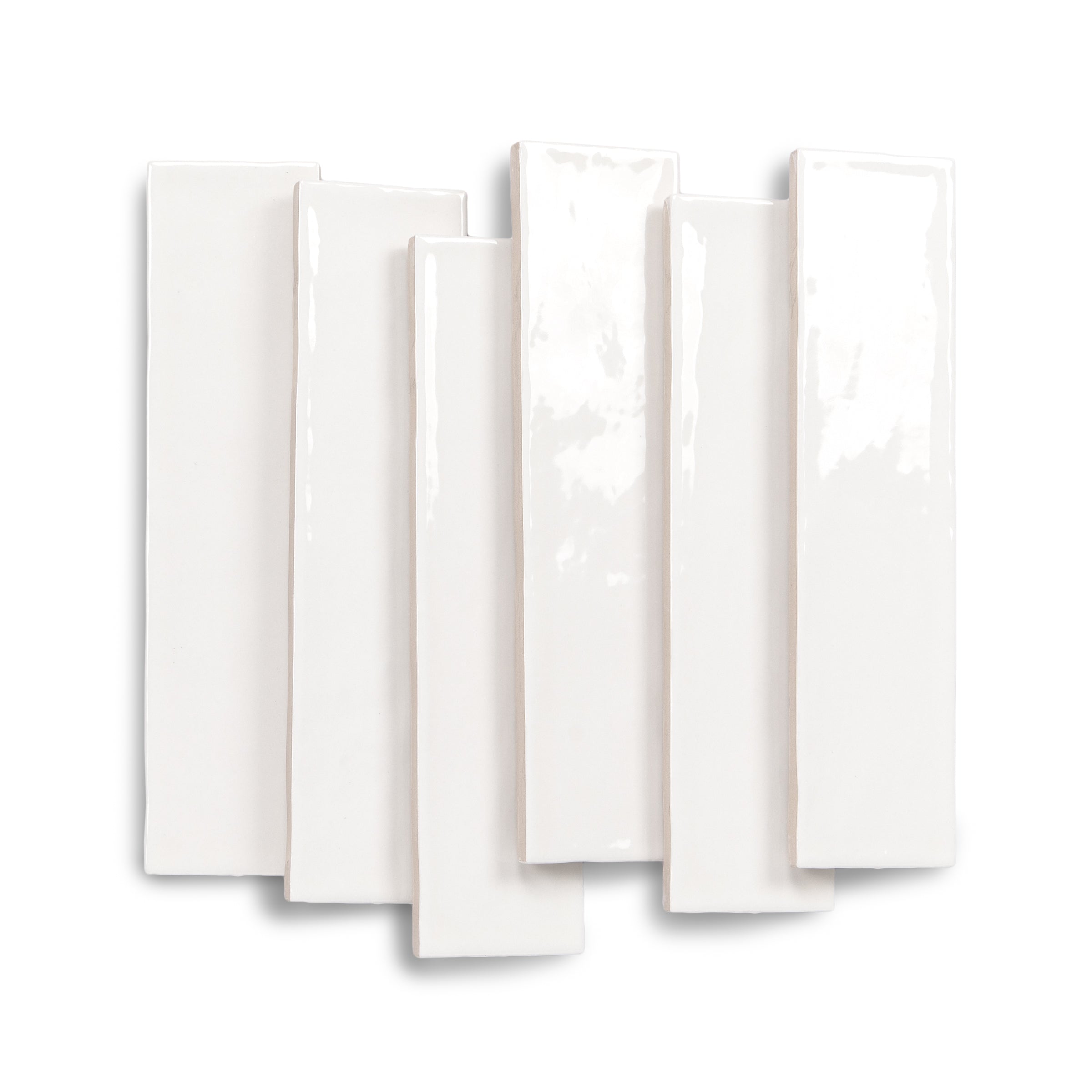 Glossy white rectangular ceramic tiles arranged in an overlapping display