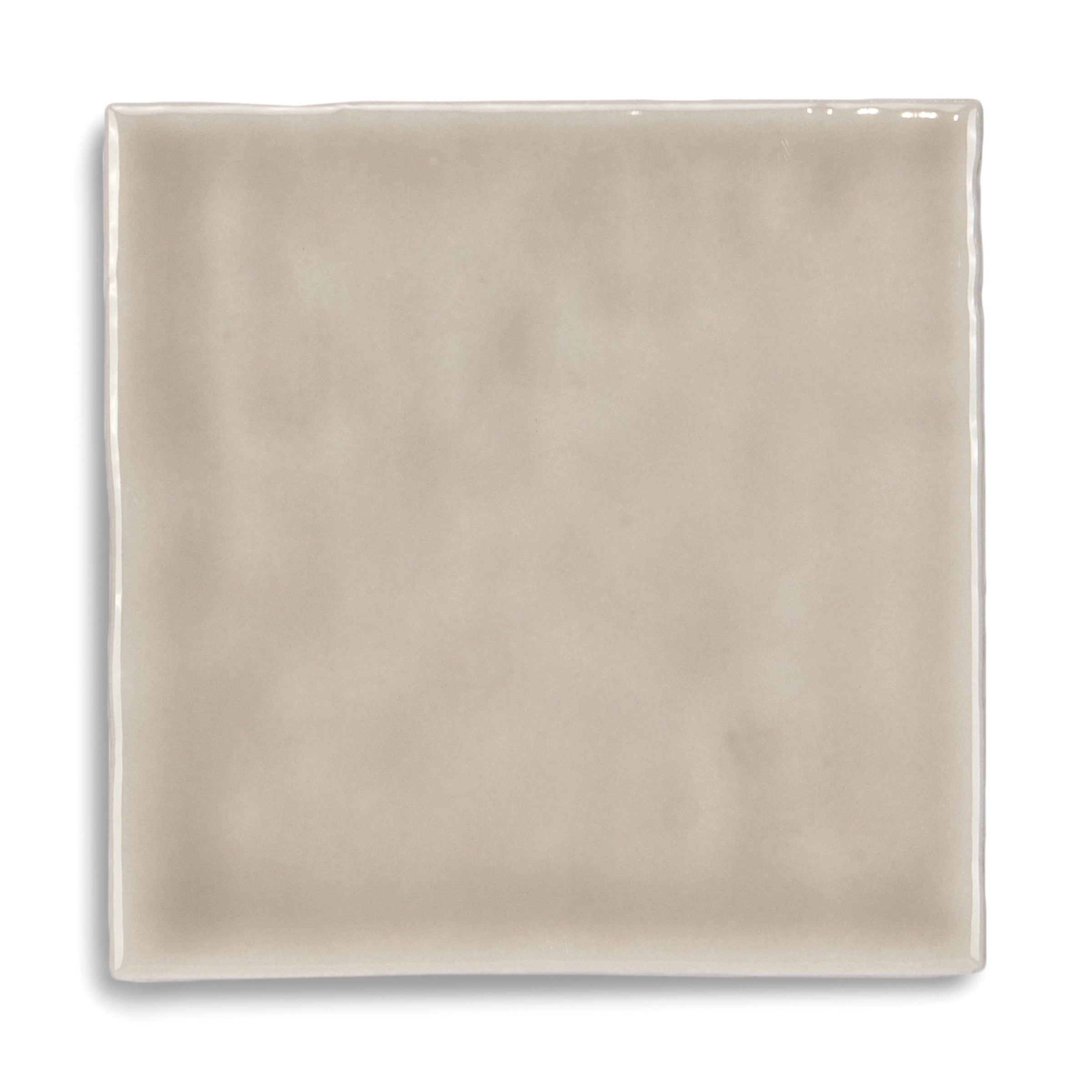 Square ceramic tile in soft taupe with a gentle sheen and smooth surface featuring subtle tone variations