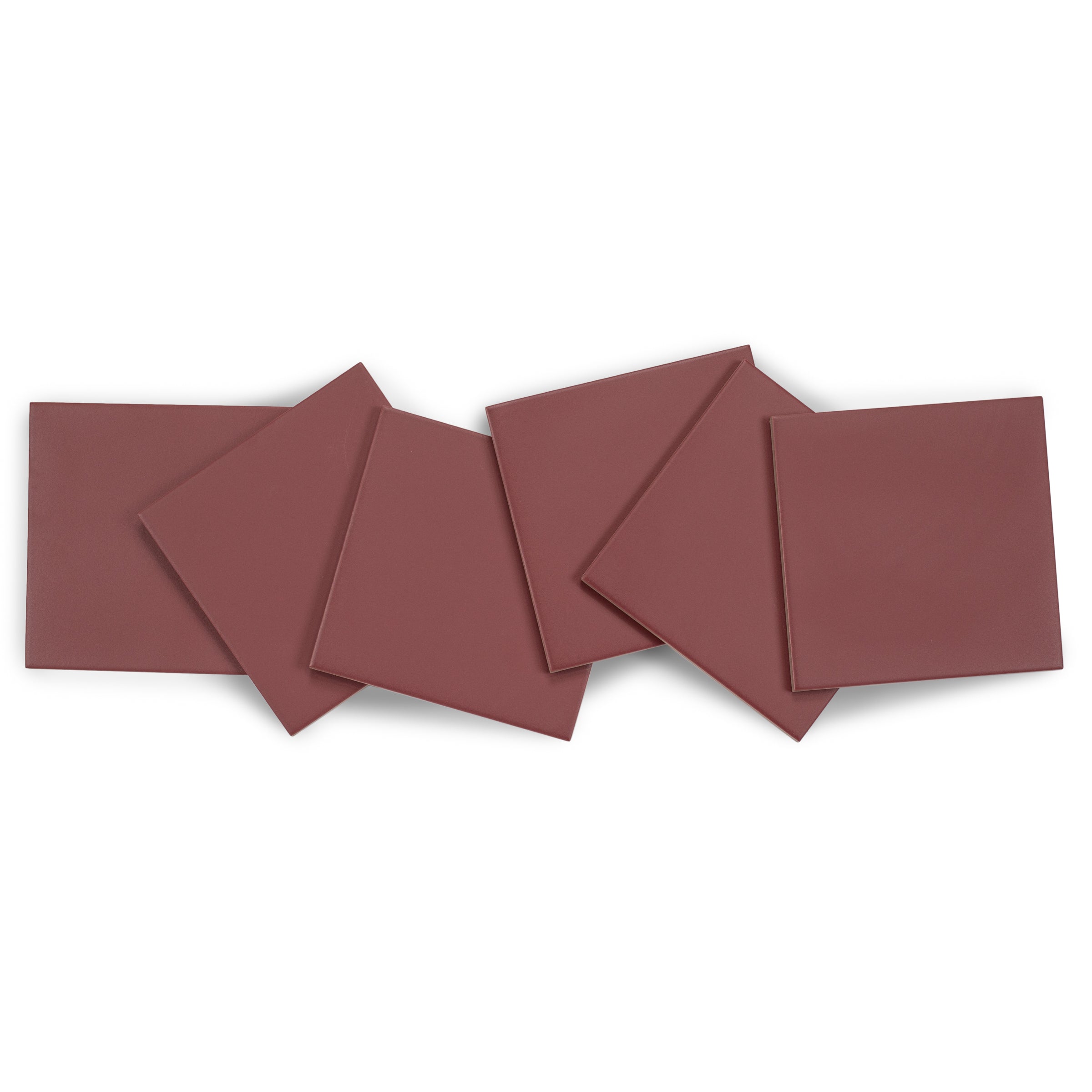 Six deep reddish-brown ceramic tiles arranged in a scattered overlapping pattern on a white background