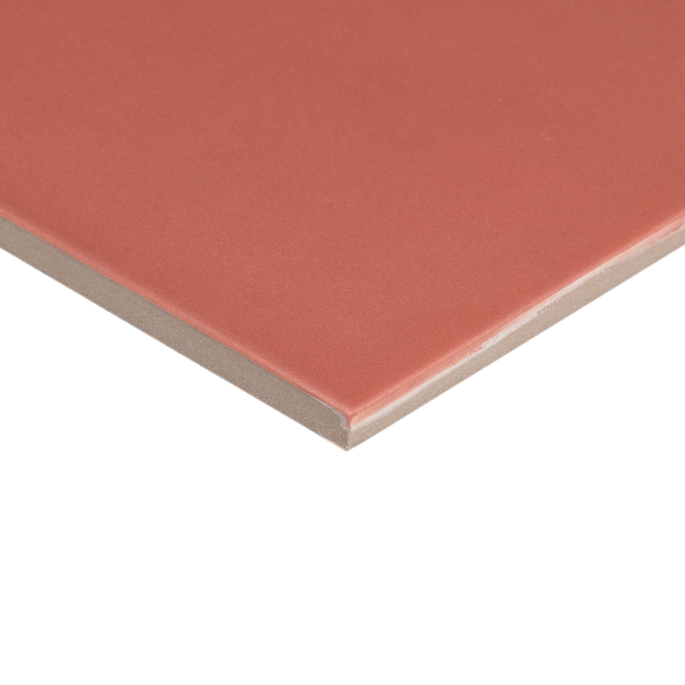 Close-up of a small terracotta ceramic tile with smooth matte surface and thin edges for flooring or wall use