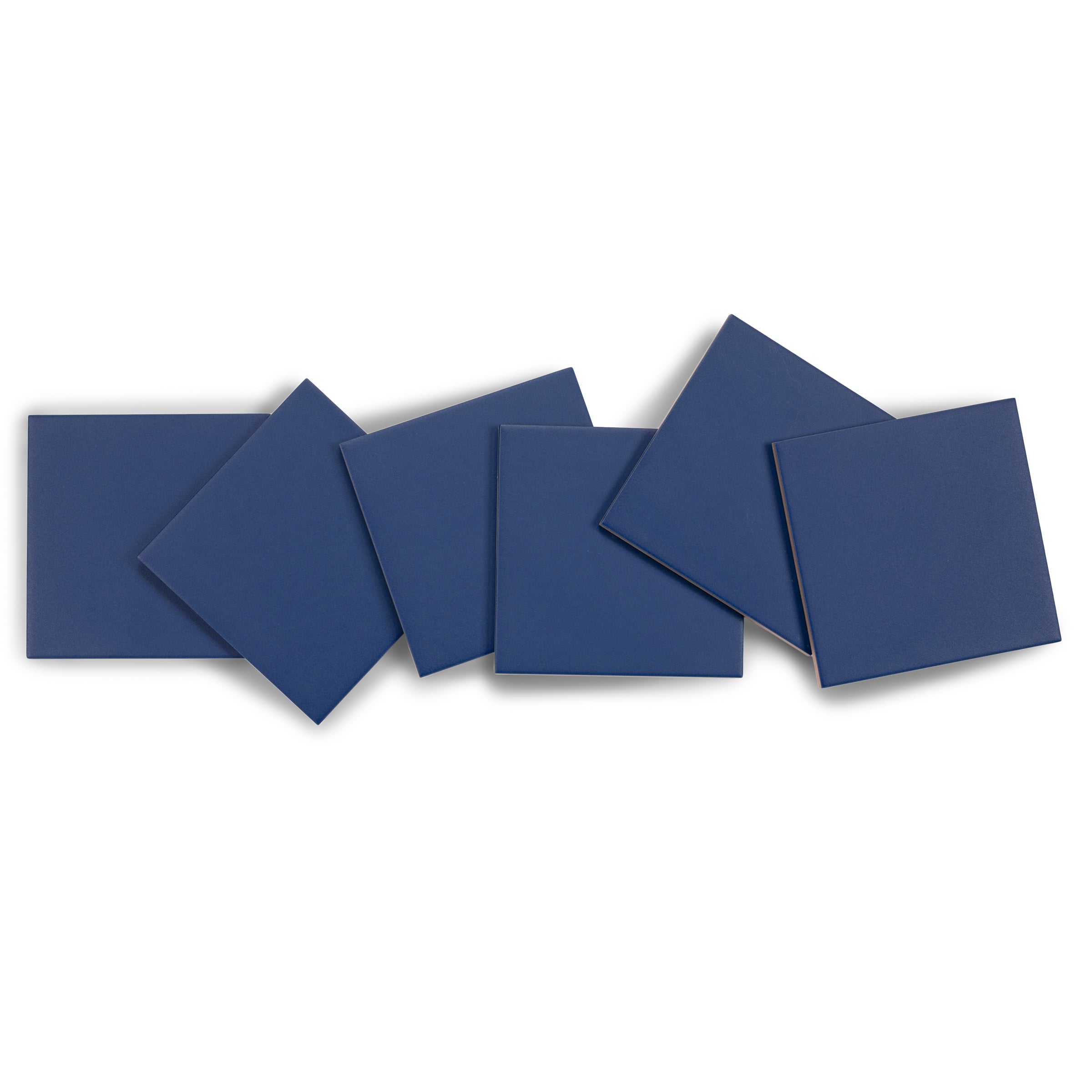 Six matte navy blue square ceramic tiles arranged overlapping on a white background