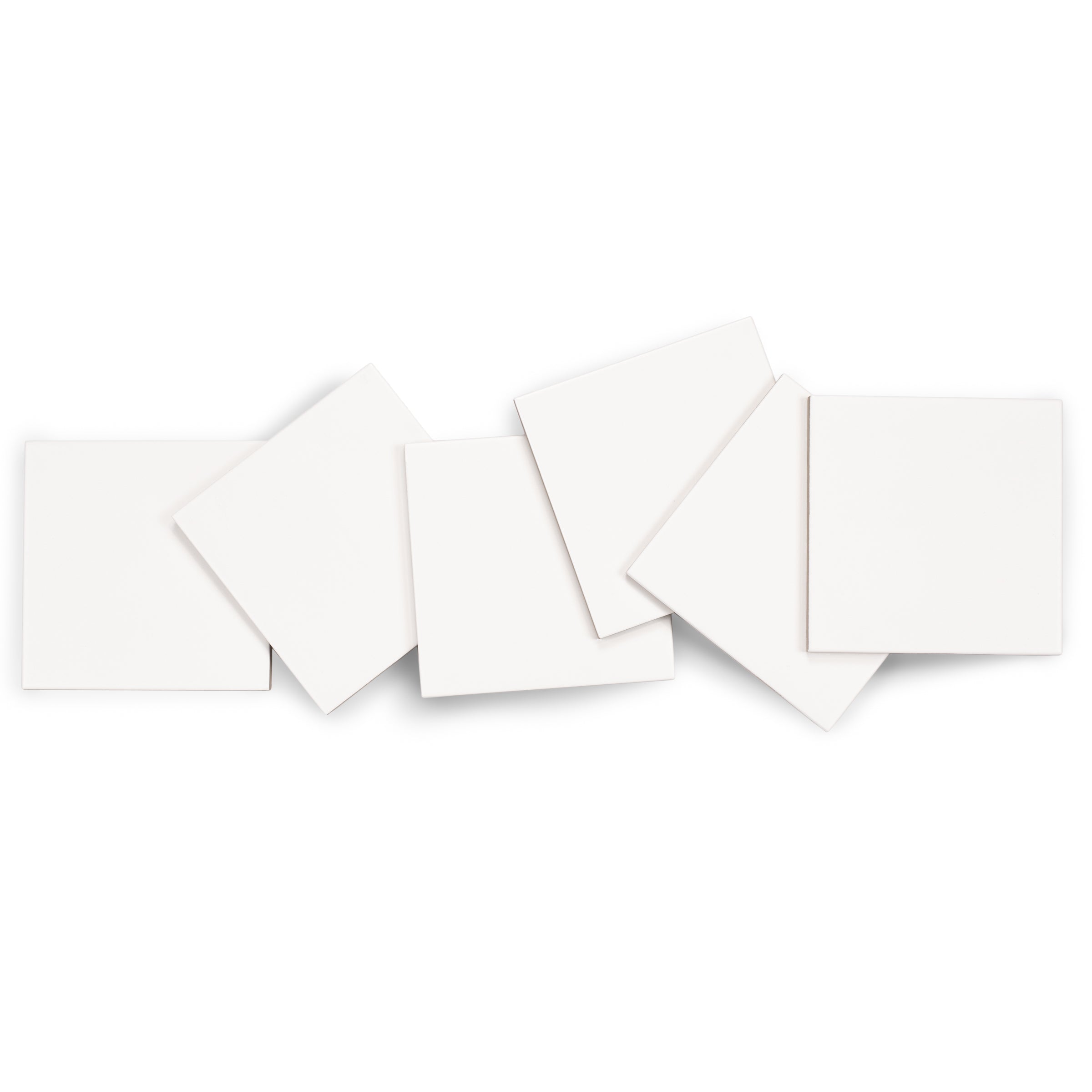 Seven overlapping white square porcelain tiles arranged on a white background with soft shadows.