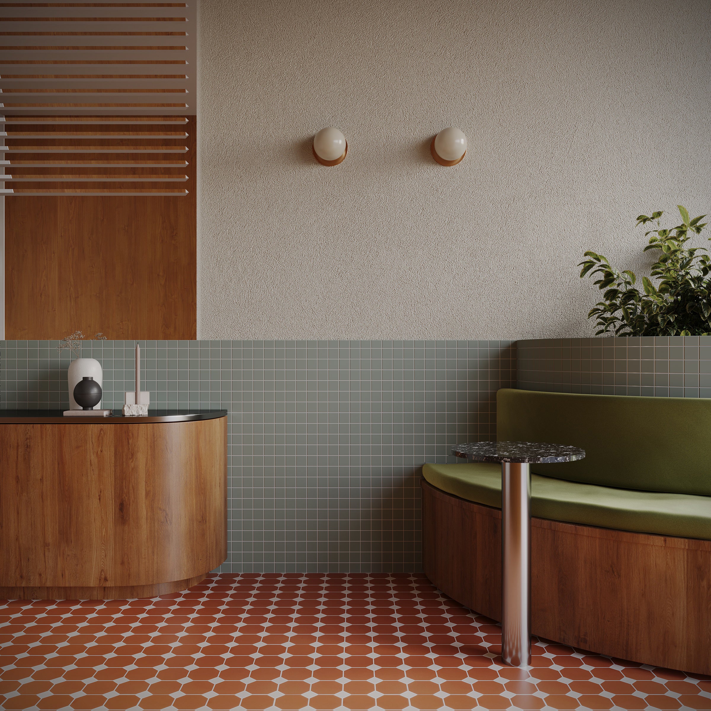Modern interior space with terracotta octagon tiles, green tiled half-wall, curved olive bench, and wood cabinetry accents.
