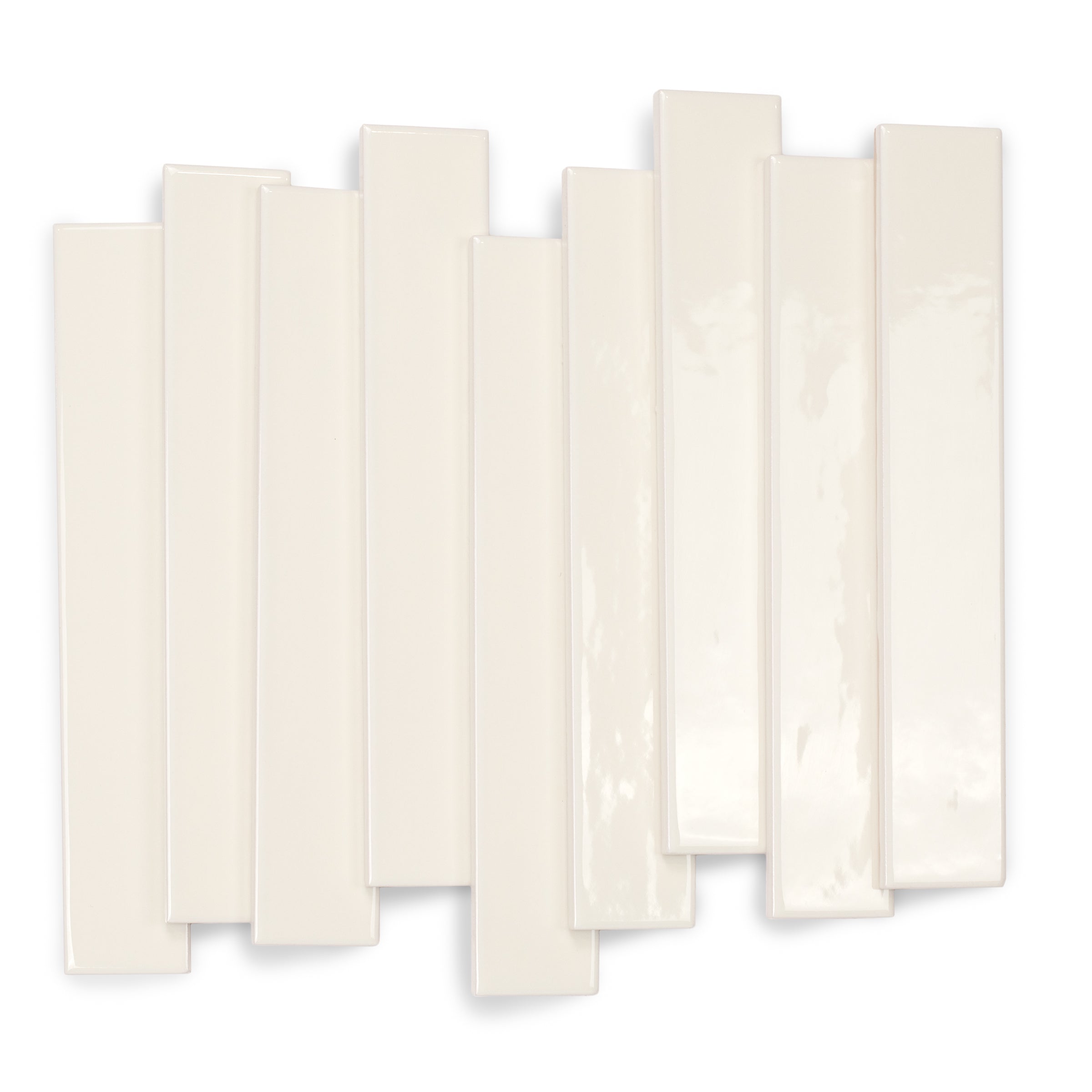 Glossy cream ceramic tiles in slim rectangular shapes arranged randomly on a white background for creative design ideas