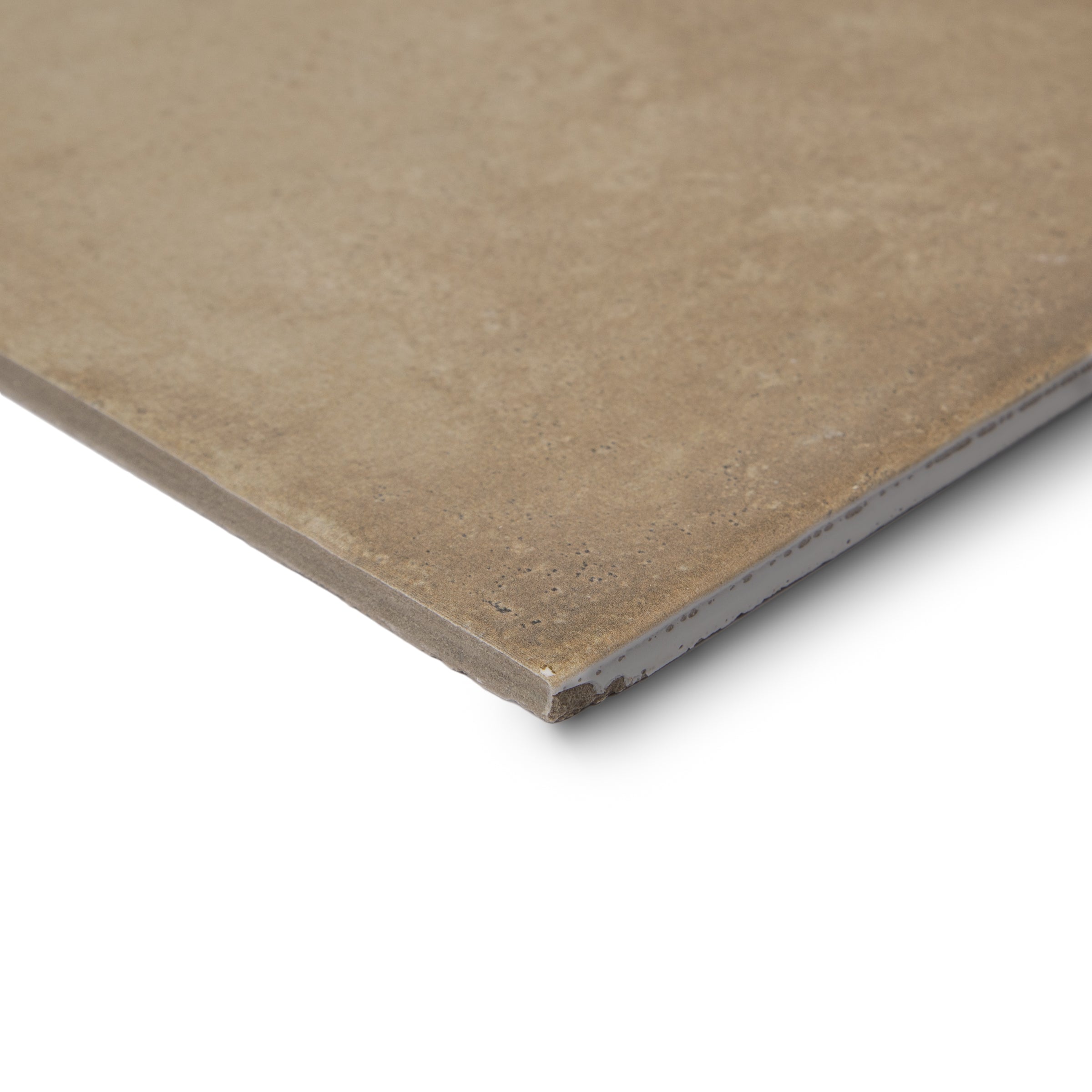 Close-up of a single large-format ceramic tile in muted earthy brown tones with a matte, slightly textured surface
