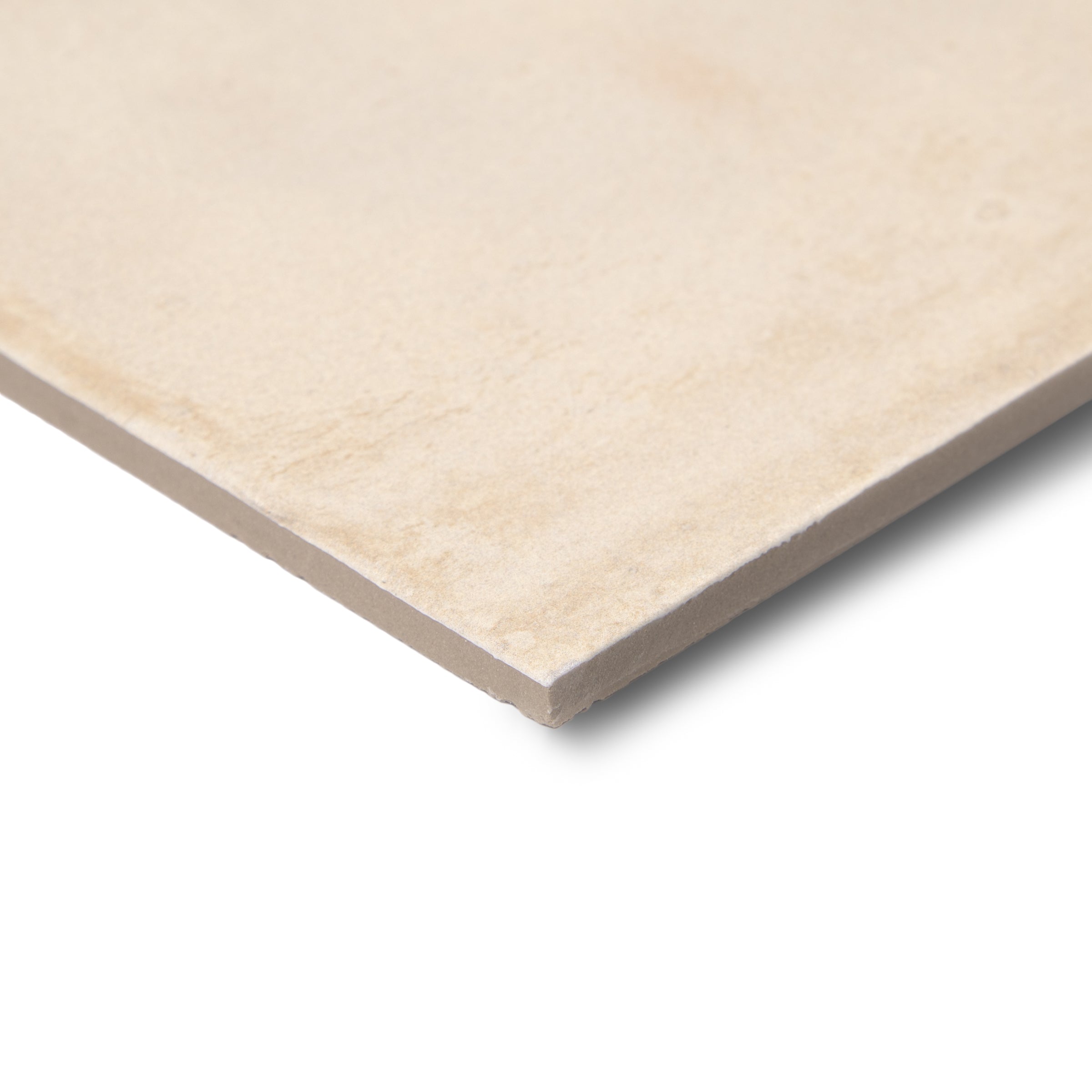 Close-up of a large-format ceramic tile in soft beige with a smooth matte surface and subtle natural veining