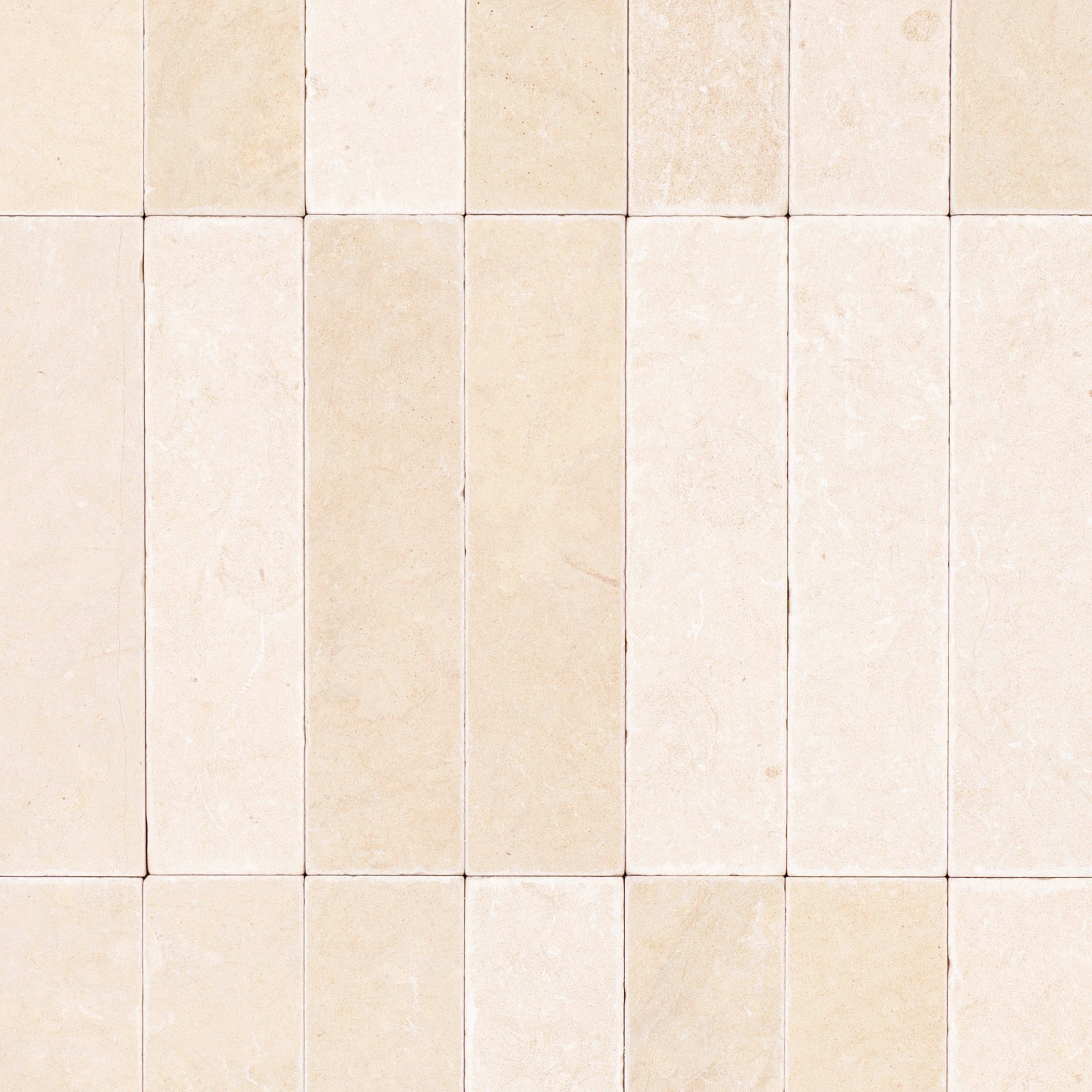 Desert Tea 2x8 Tumbled Marble Tile in beige tones with soft gold hues from Tumbled Natural Stone Tiles Stone New Arrivals GREY collection