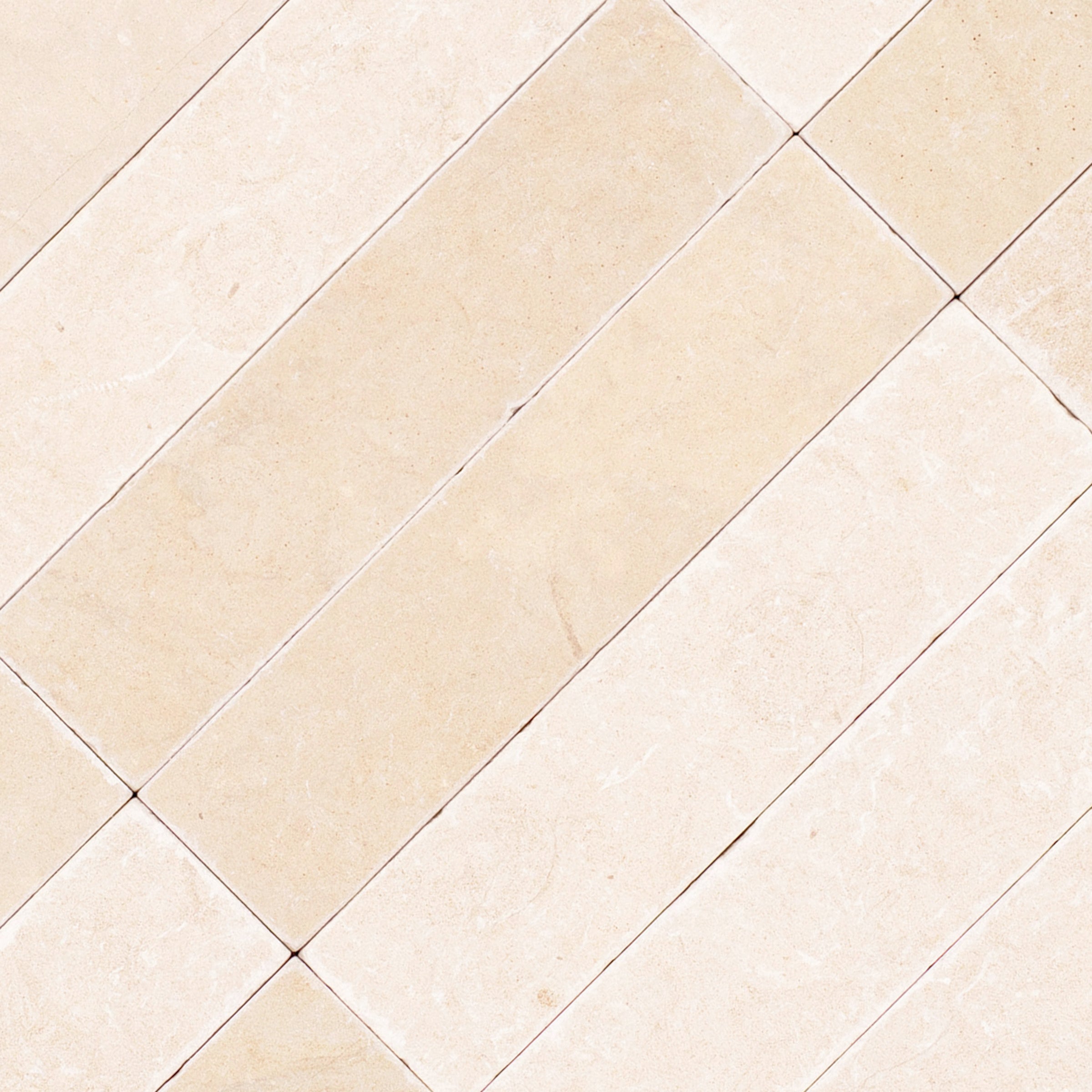Desert Tea 2x8 Tumbled Marble Tile in beige and cream tones from Tumbled Natural Stone Tiles Stone New Arrivals GREY