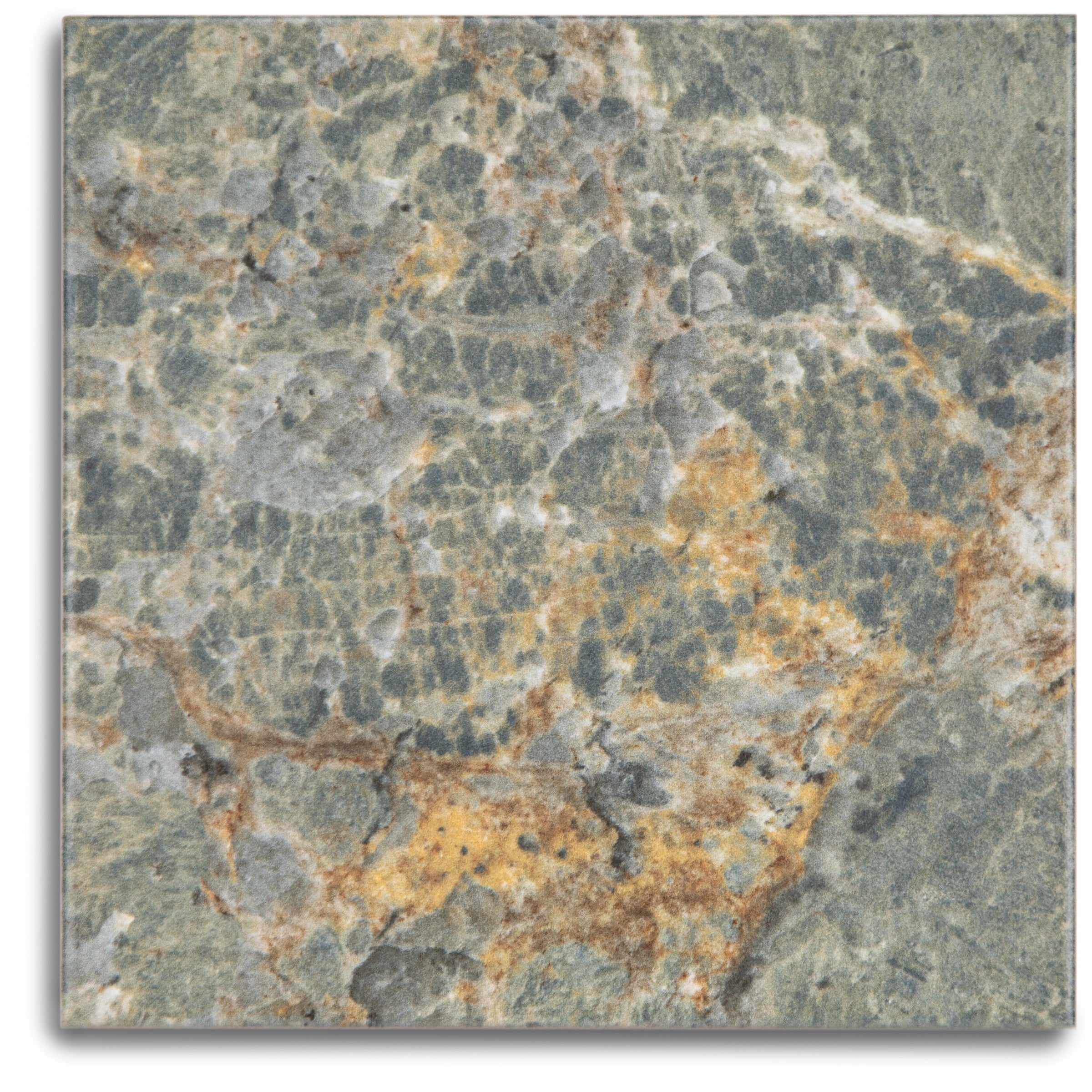 Close-up of matte porcelain tile with natural stone pattern in green, gray, and warm amber tones for flooring or walls