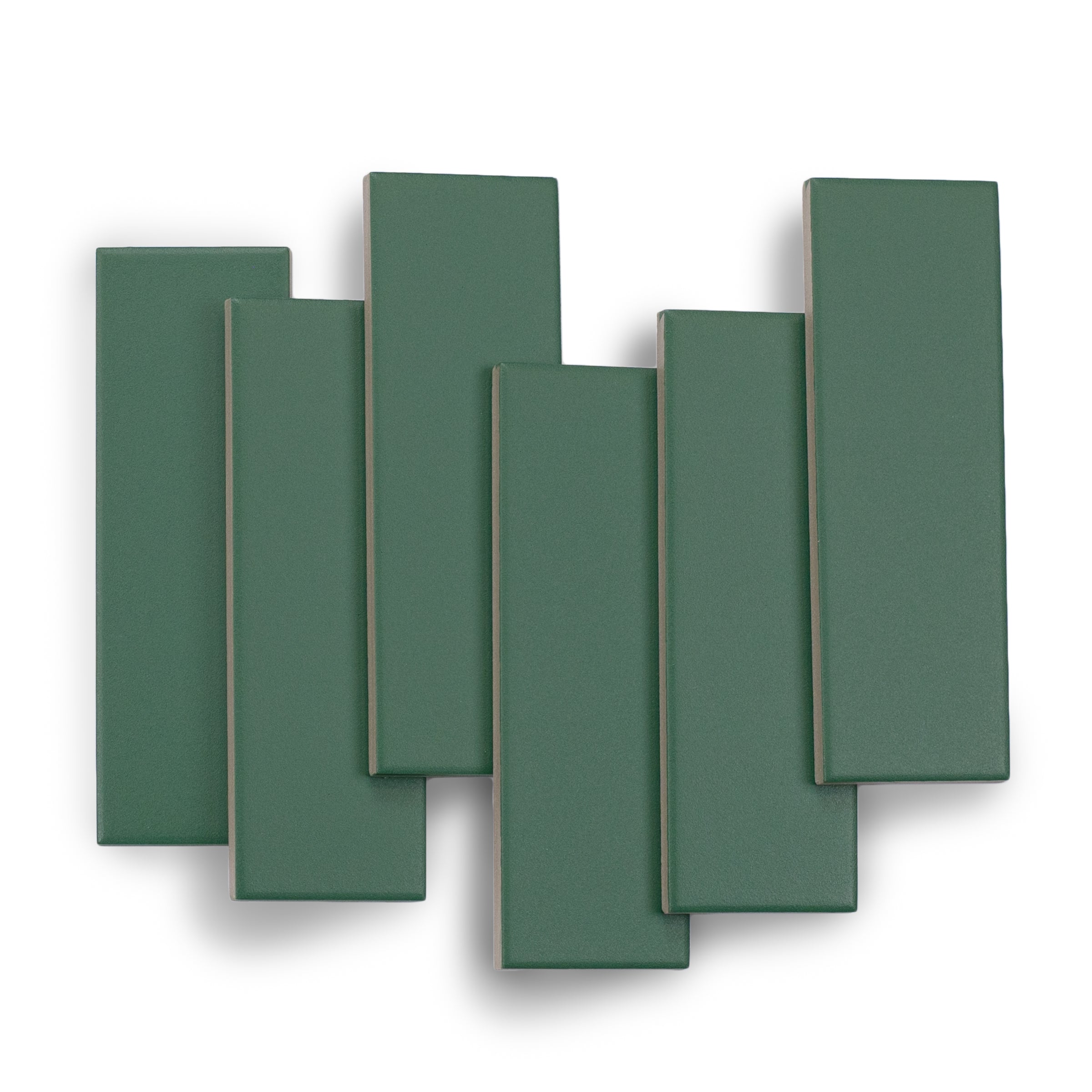 Seven rectangular matte porcelain tiles in a muted emerald green shade arranged loosely on a white background