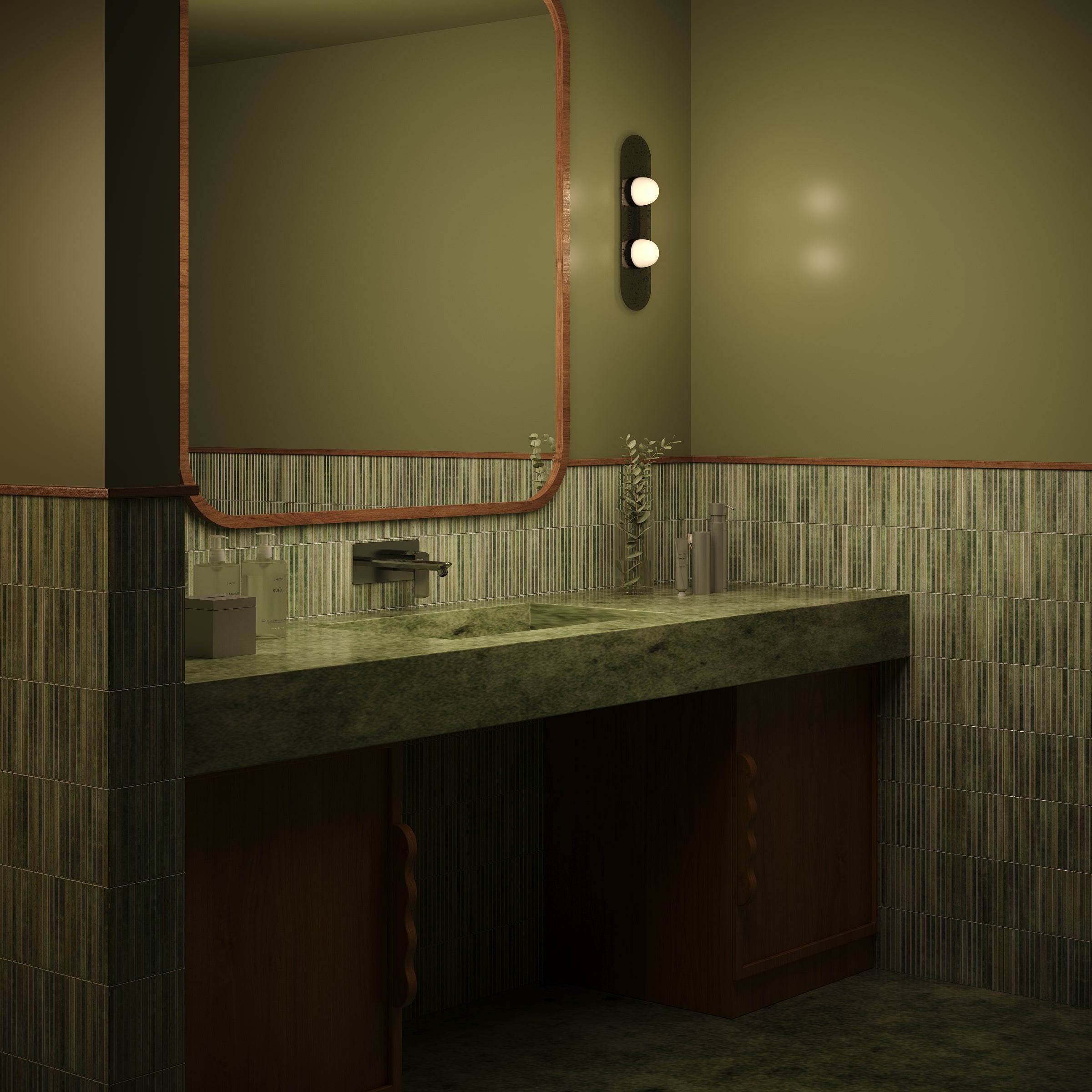 Textured vertical ceramic green tiles cover the lower bathroom walls with a matching stone countertop and wood cabinetry below