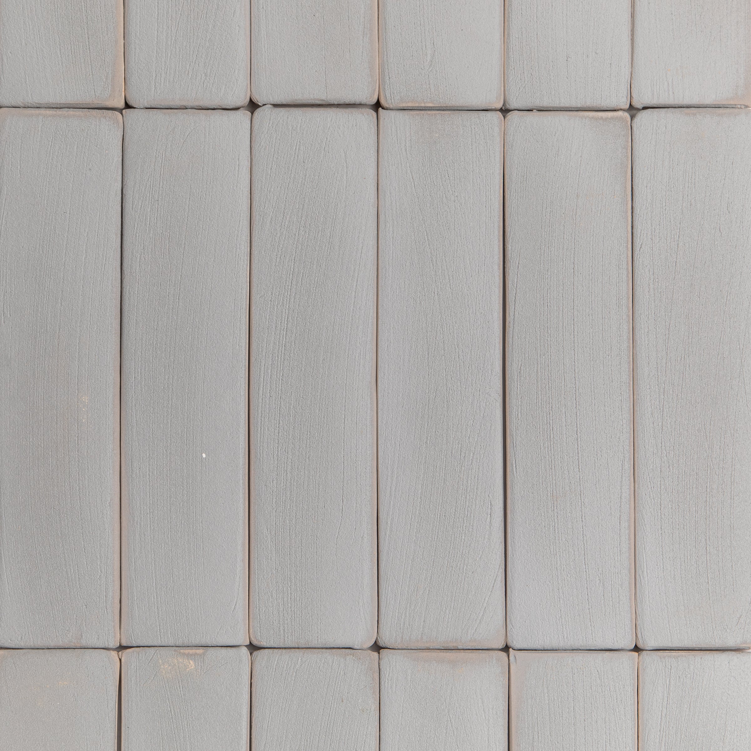 Grey Cotto Antico Terracotta Tile in a small format layout showing smoky grey handcrafted terracotta with natural texture details