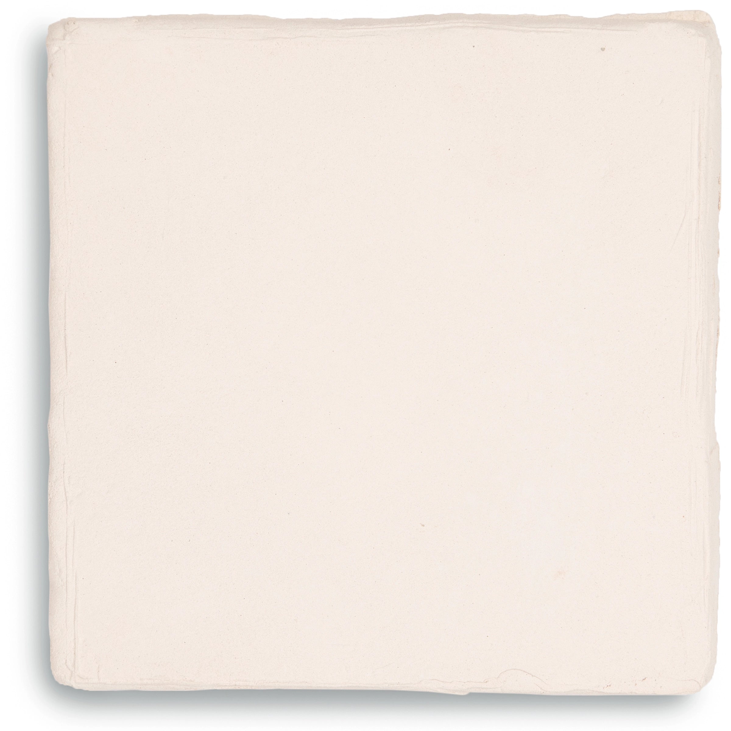 Single square ceramic tile in soft ivory with gently uneven edges and a matte finish