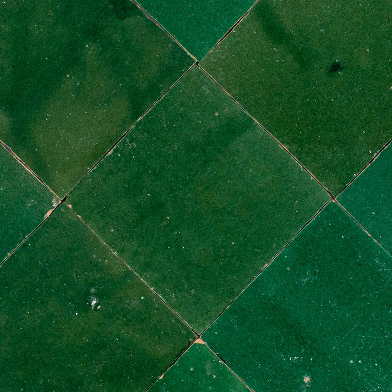 Jade Glazed Zellige Tile in green terracotta with emerald and forest hues from Small Format Tiles and Handmade Moroccan Zellige Tiles