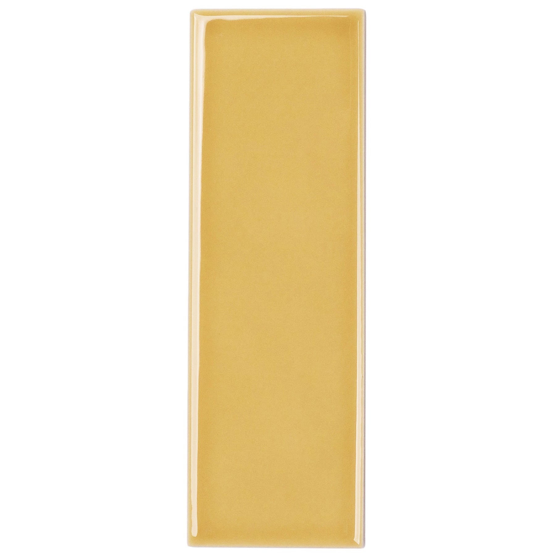 Mustard 2x6 Gloss Porcelain Tile Sample in porcelain collection, globally sourced for your imagination by Reno Source