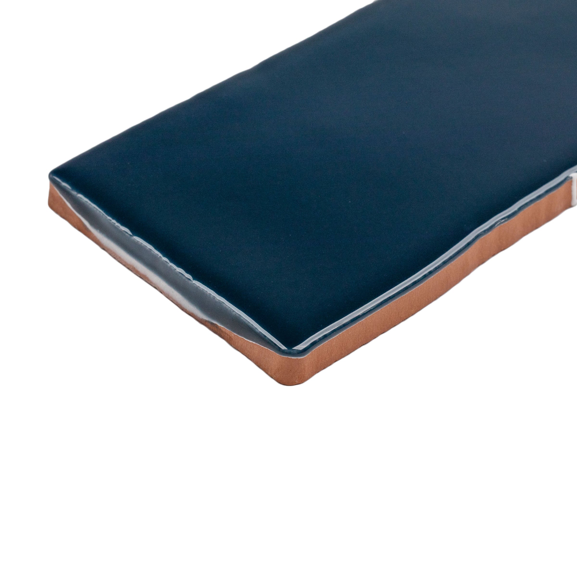 Marine 3x12 Glossy Ceramic Tile in deep teal-navy with rich gloss and gently irregular edges from Seville Small Format Tiles collection