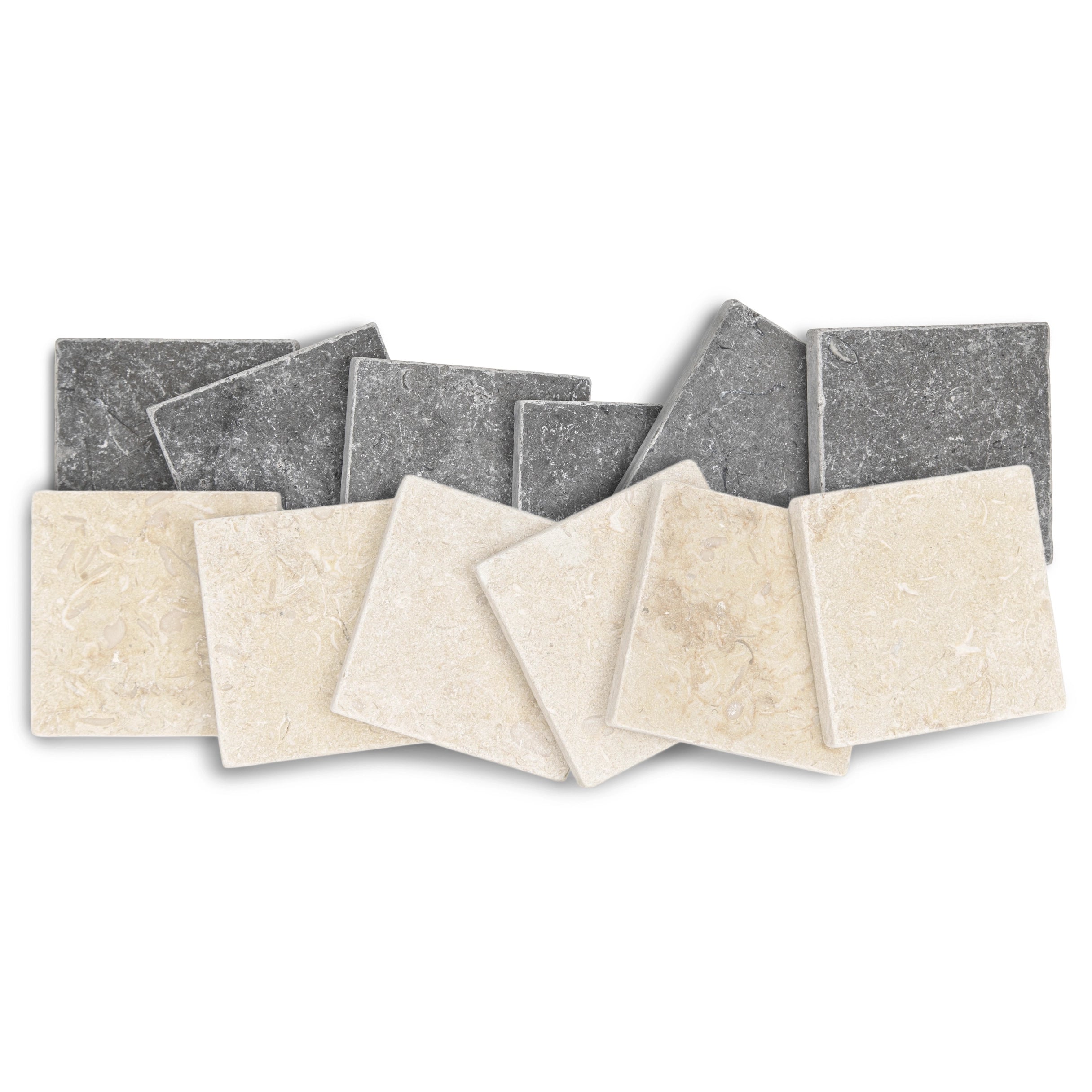 Assortment of small square stone tiles in light cream and deep charcoal with natural textured surfaces