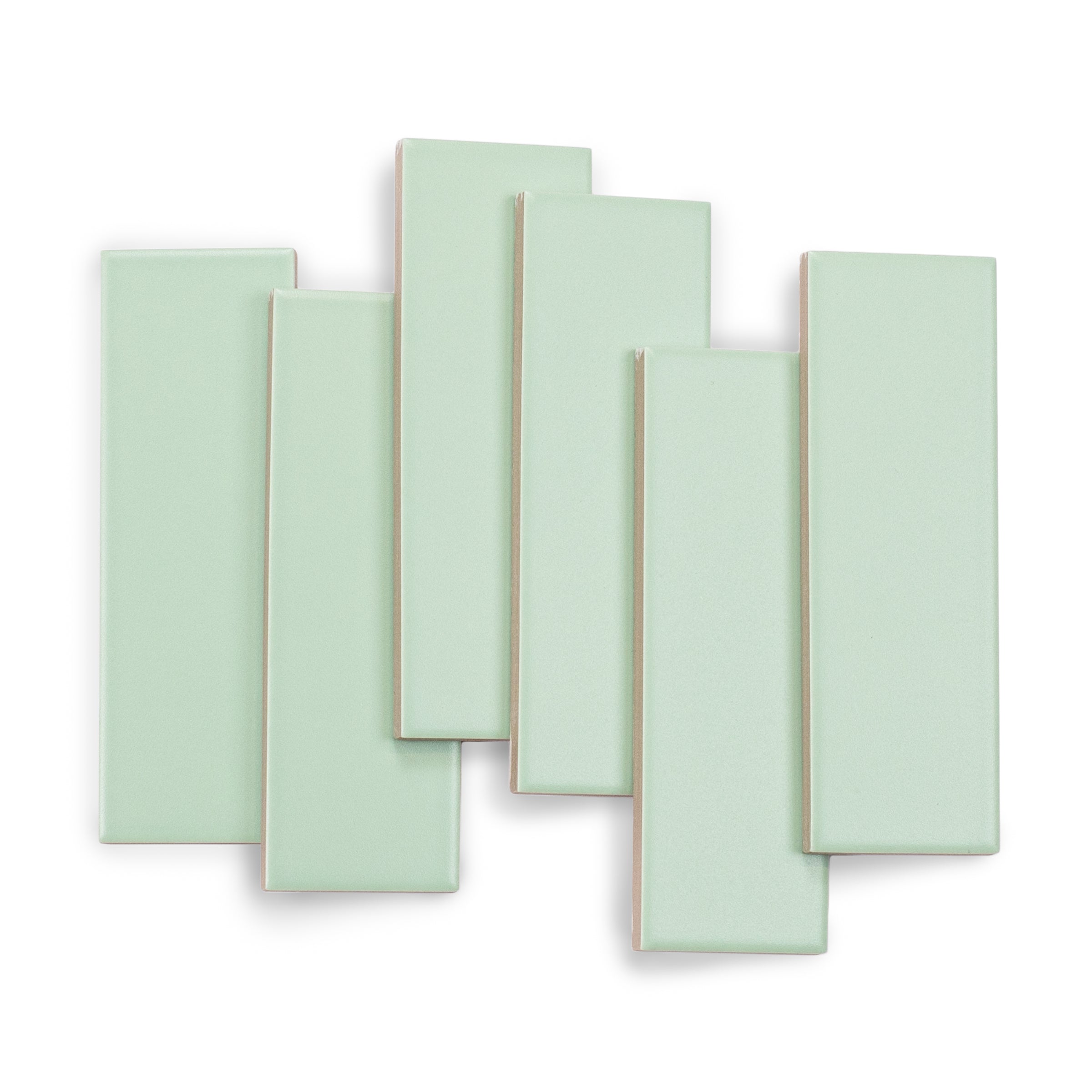 Set of six narrow rectangular porcelain tiles in a soft matte mint green shade on white background