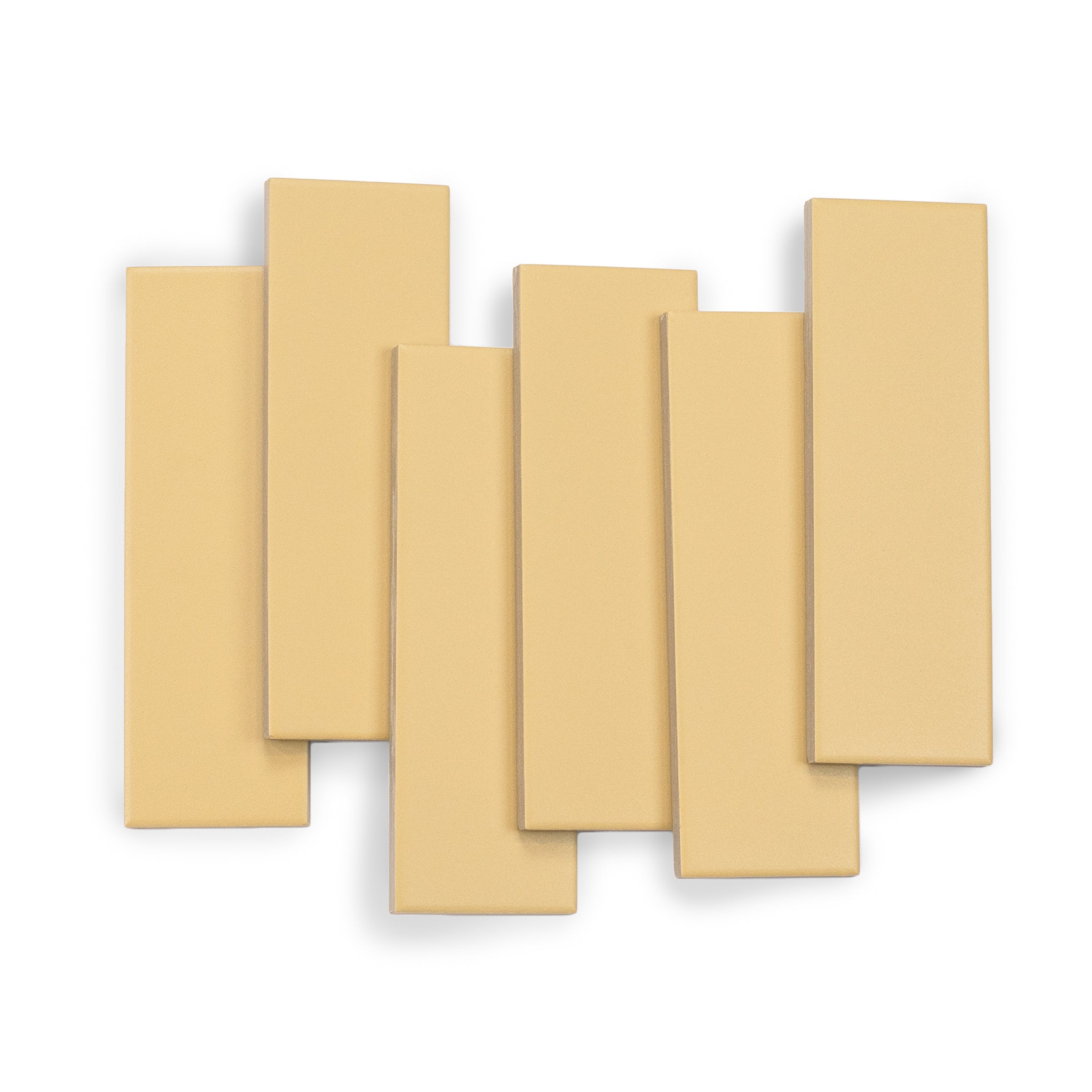 Set of seven rectangular porcelain tiles in a soft mustard shade with smooth matte texture on white background
