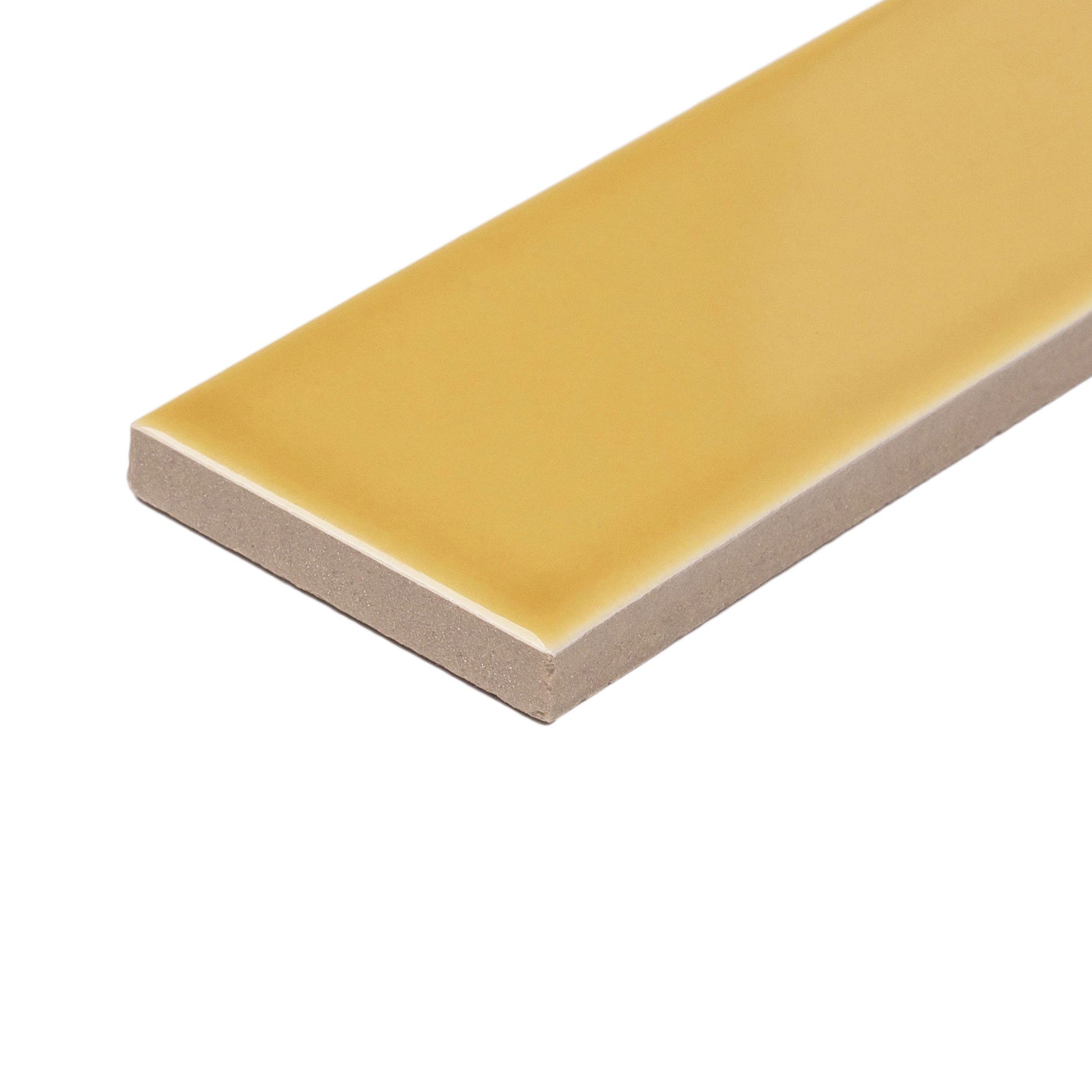 Glossy rectangular ceramic tile in muted mustard yellow with smooth surface and straight edges on white background