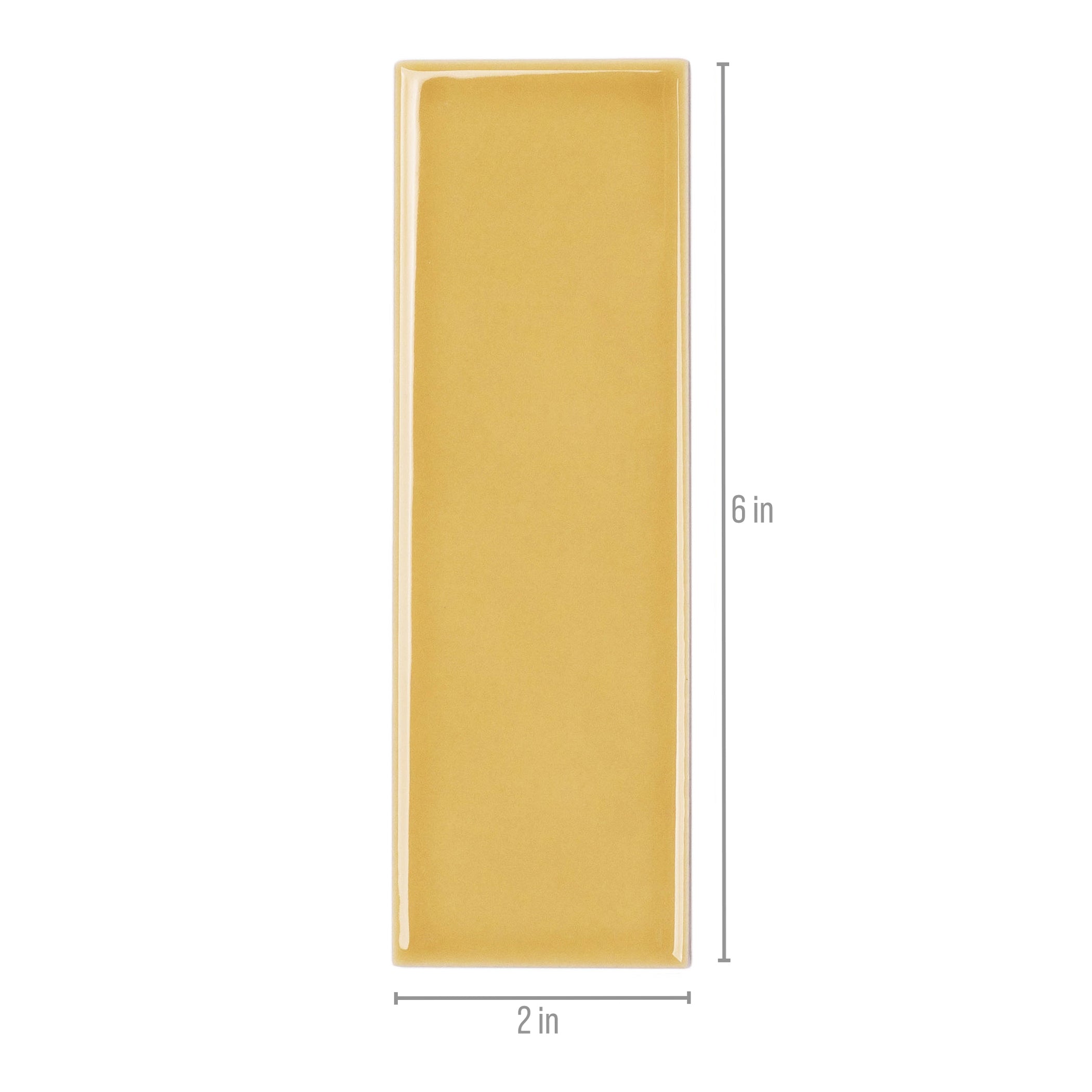 Glossy rectangular ceramic tile in warm mustard yellow with smooth surface and straight edges on white background